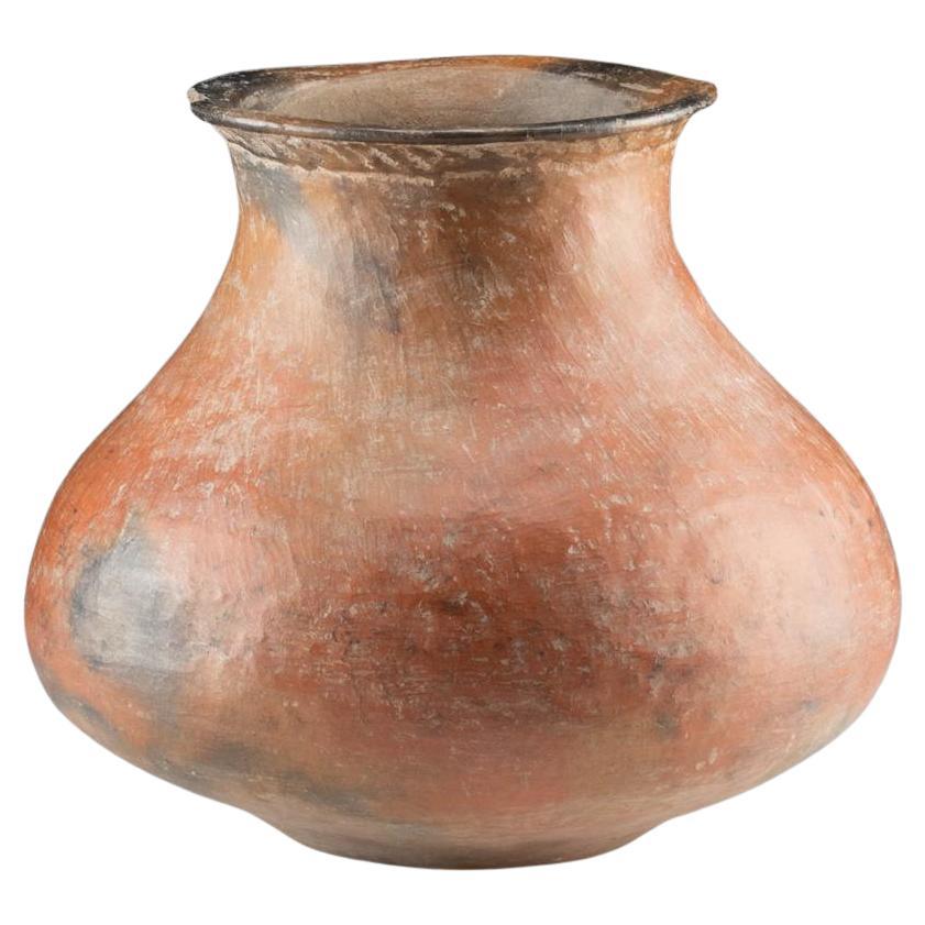 Large Colima Redware Pottery Jar, West Mexico, Colima, ca. 300 BCE–300 CE
This elegant ancient vessel is a classic example of Colima redware, crafted in West Mexico between 300 BCE and 300 CE. Featuring a bulbous “globular” form that tapers