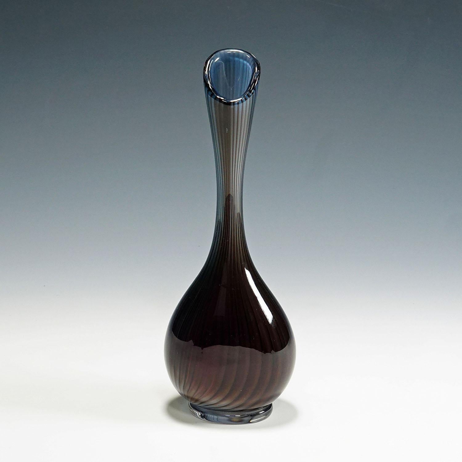 Large Colora vase by Vicke Lindstrand for Kosta 1953.

Art glass vase of the Colora series, designed by Vicke Lindstrand for Kosta Glassworks. This particular piece is an early work from the Colora series, which first appeared in the Kosta catalogue