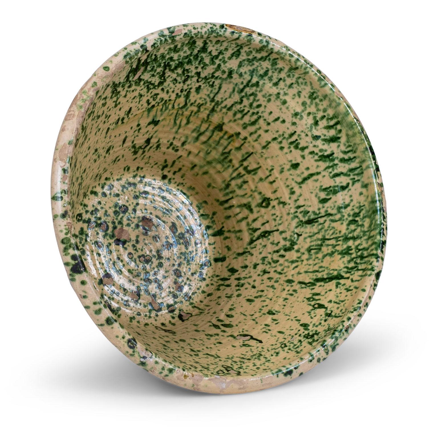 Large colorful glazed terracotta passata bowl from southern Italy (Puglia). This rustic 19th century terracotta bowl was used in the Italian countryside to make tomato passata. Handcrafted and glazed in a pesto-color green pattern over butter-cream.