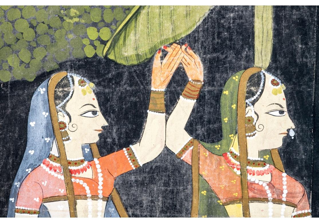 A 20th century pichwai painting, made on cloth, depicting a tale from Lord Krishna's life. Painted on cloth, it shows Shrinathji wearing festive clothes and jewelry with Gopis on both sides offering them prayers and sweets, herds of cows and flowers