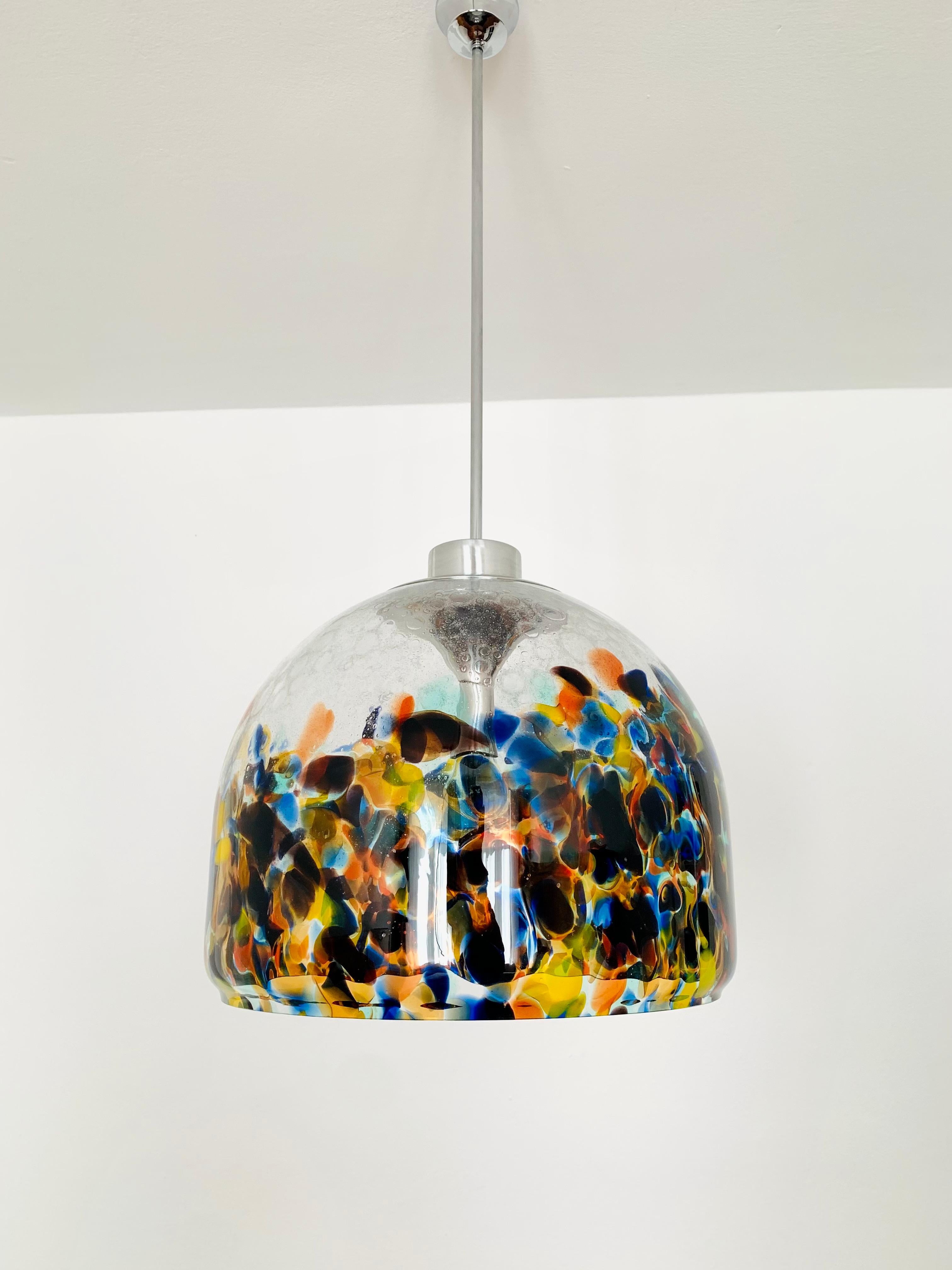 Impressive large colorful Murano glass lamp from the 1960s.
Extraordinarily successful design and very high-quality workmanship.
The colored glass decor creates a very exciting light effect.

Condition:

Very good vintage condition with slight signs