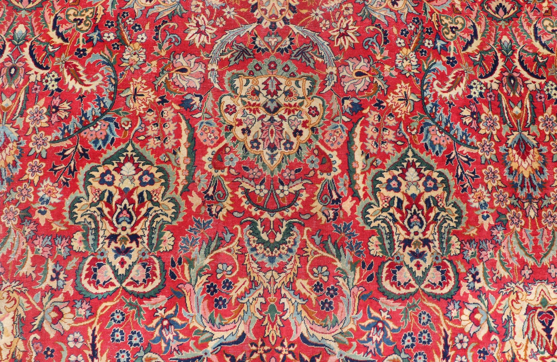 Large Tabriz Vintage Rug in All-Over Floral Design On A Red Field with Multi Colors. Keivan Woven Arts / rug X23-0611-443, country of origin / type: Iran / Tabriz, circa 1940. 

Measures: 12'8 x 19'1 

This large and charming Tabriz  has a classic 