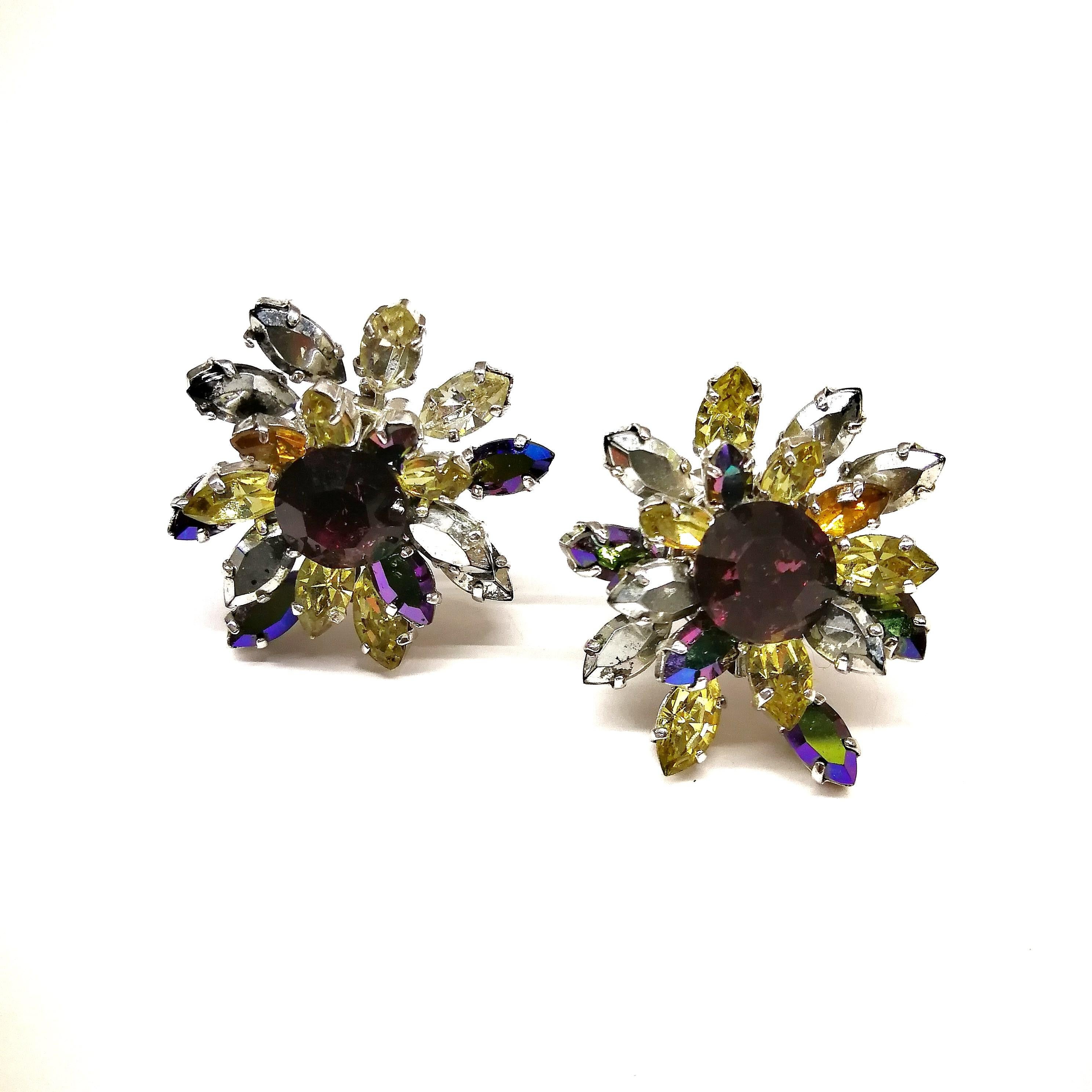 A stunning and highly collectable pair of 'cluster' earrings by Christian Dior from 1959, true examples from when Yves Saint Laurent was at the helm of the couture house, the successor to Dior himself. Using the best Austrian crystal pastes, and