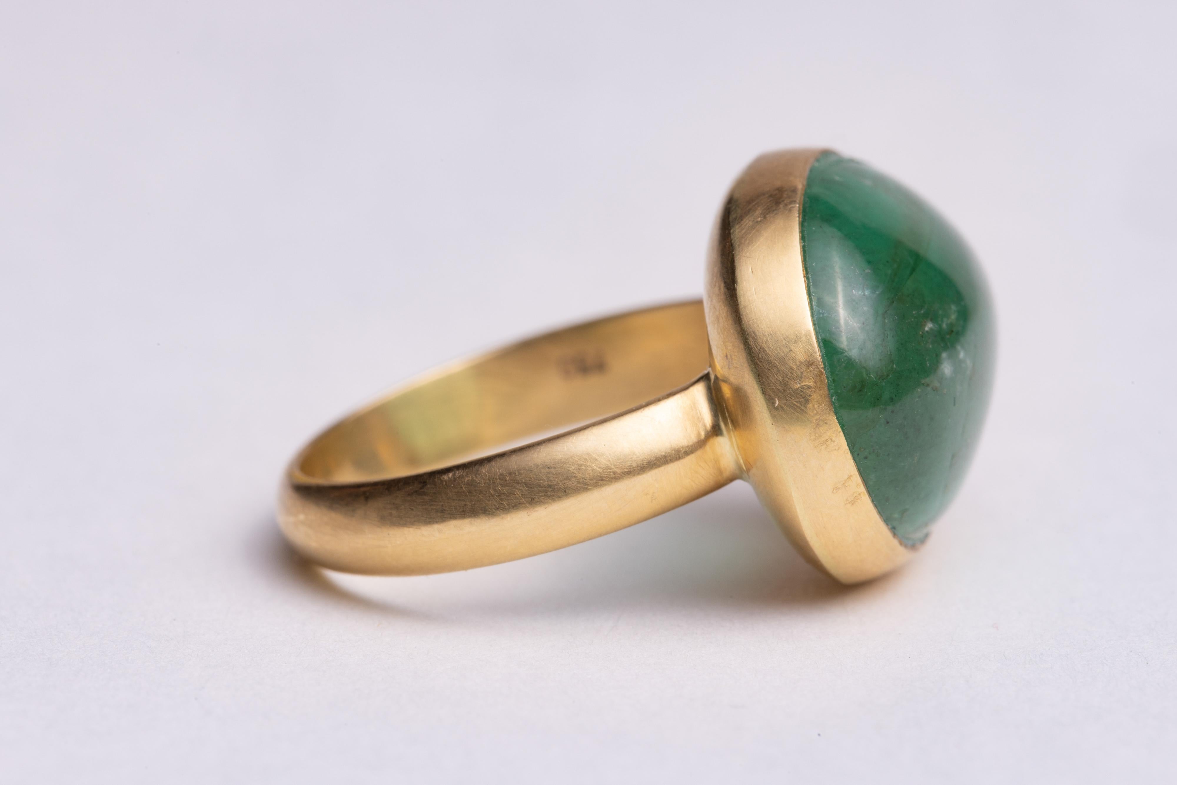 An amazing large oval Colombian Emerald dome ring set in 22K gold.  Simple and elegant.  The emerald is 13.45 carats.  Ring size is 7.75 and easily sized.