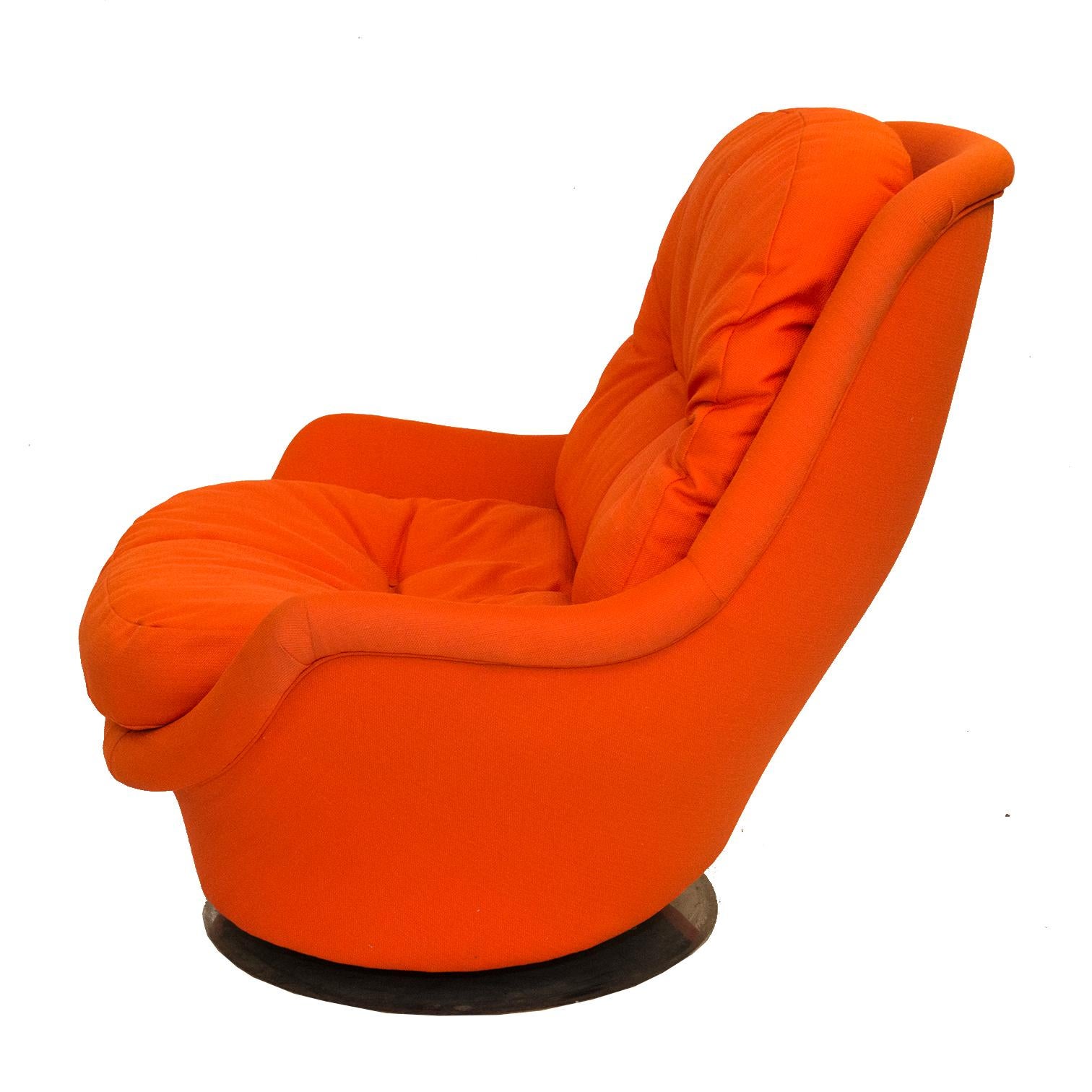 A hard to find swivel rocker by Milo Baughman for Thayer Coggin. Redone in our Connecticut Workshop in a super-fun, daring orange fabric. Club chair tilts and swivels. Extremely comfortable and loads of fun!