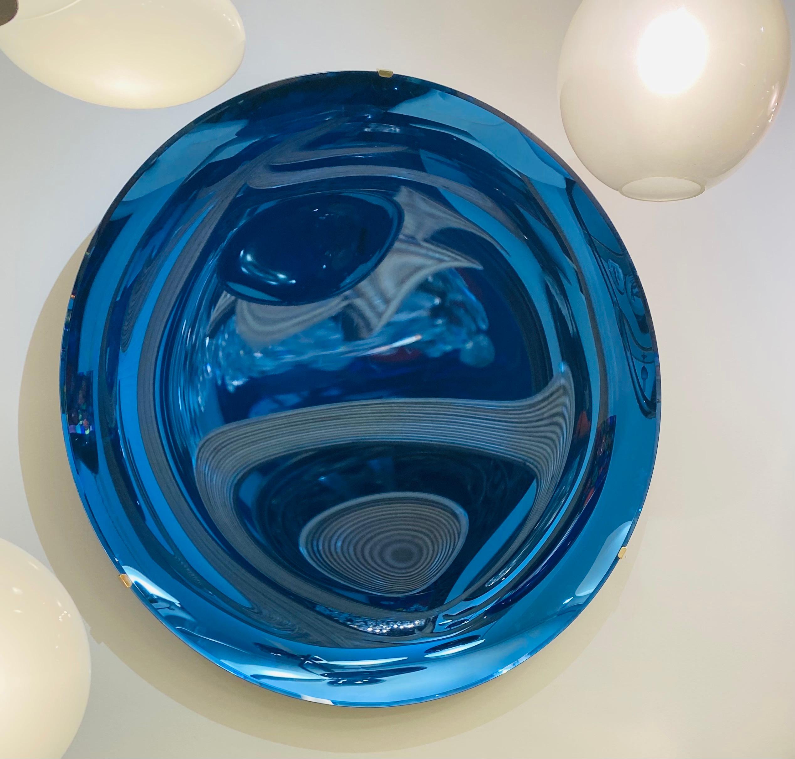 An extraordinary and unique Italian contemporary art mirror in blue concave hand blown glass.
 