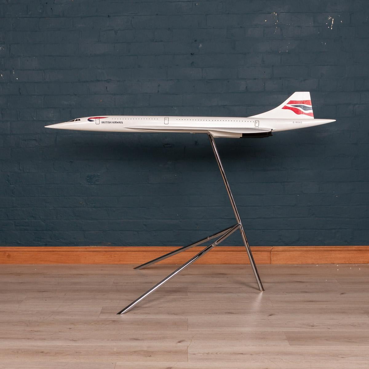 A superb vintage fibreglass and plastic composite model of a Concorde in full British Airways livery mounted on original chrome plated stand by Space Models, circa 1980. This 1:36 scale aircraft model was presented to one of BA's top travel agents