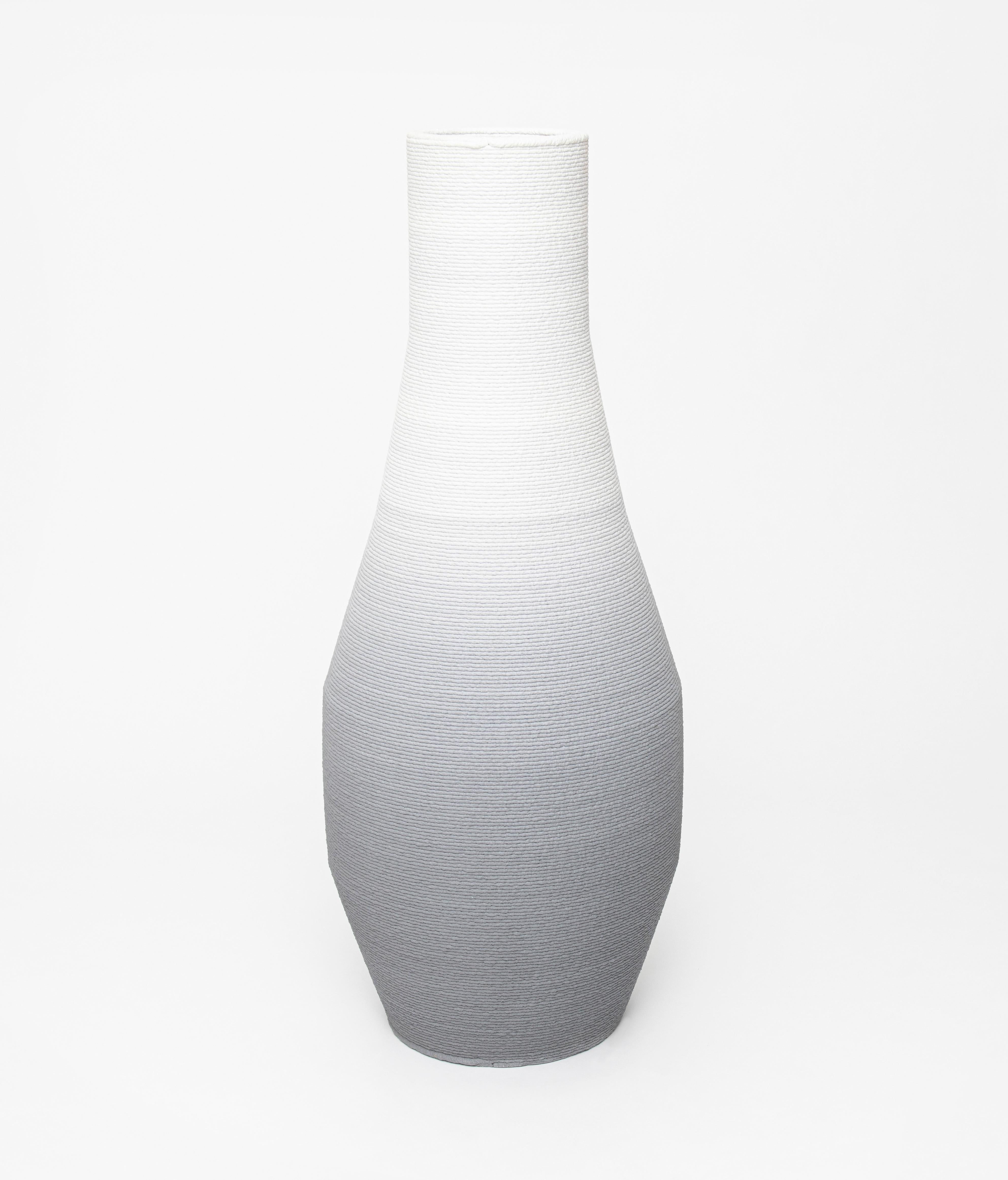 Large gradient vase by Philipp Aduatz
Limited Edition of 50
Dimensions: 60 x 60 x 152 cm
Materials: 3D printed concrete dyed, reinforced with steel

Available in red, blue, beige, green and black.

The 3D printed gradient furniture collection