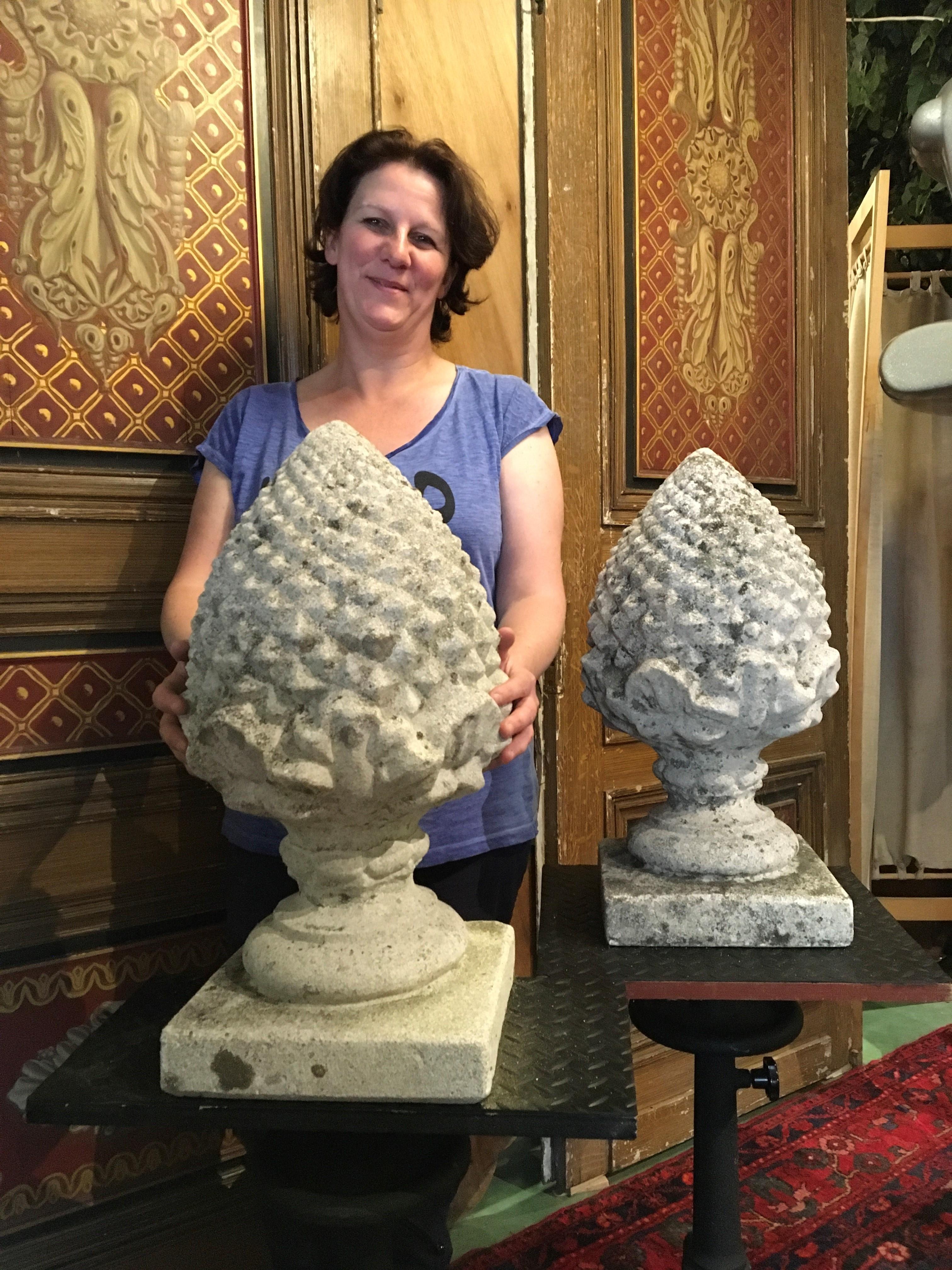 Pair of large concrete pinecone gate pillar finials. 
These large sized stone garden ornaments are great to place at the gate pillars or in the garden. Big concrete pinecone sculptures on soccles to use as decorative items or finishing touch.