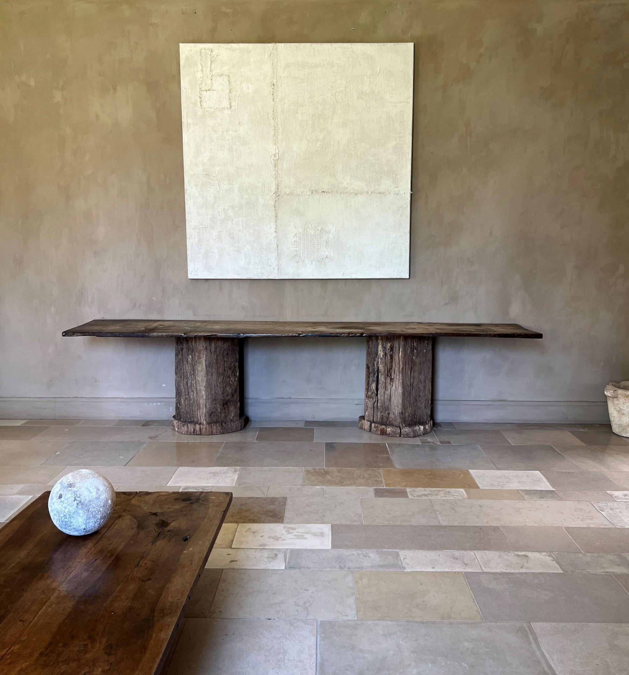 We made this console in our workshop from a one slab early 18th century Portuguese walnut top and a solid oak central windmillshaft from the same period. Alltough we found these 2 years apart from eachother and in different countries we felt these