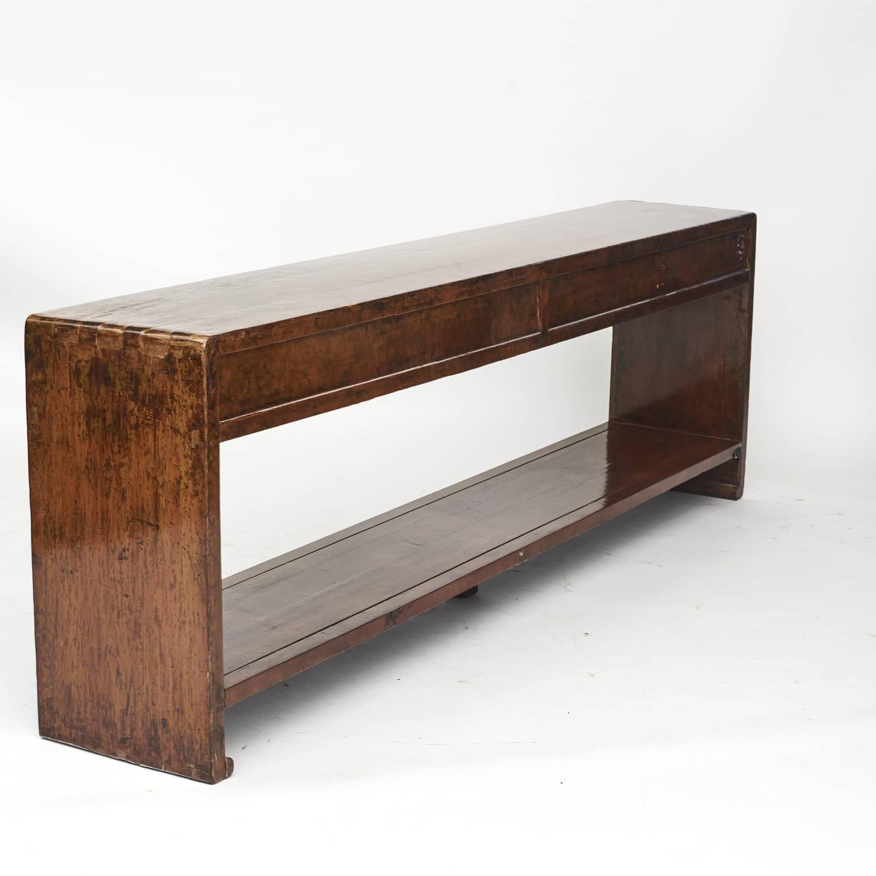 Decorative art deco console table ( 177 cm long ).
Freestanding with 4 drawers and underlying shelf.

Lacquer with brownish cinnamon shades beautiful patina.
China 1910 - 1915.