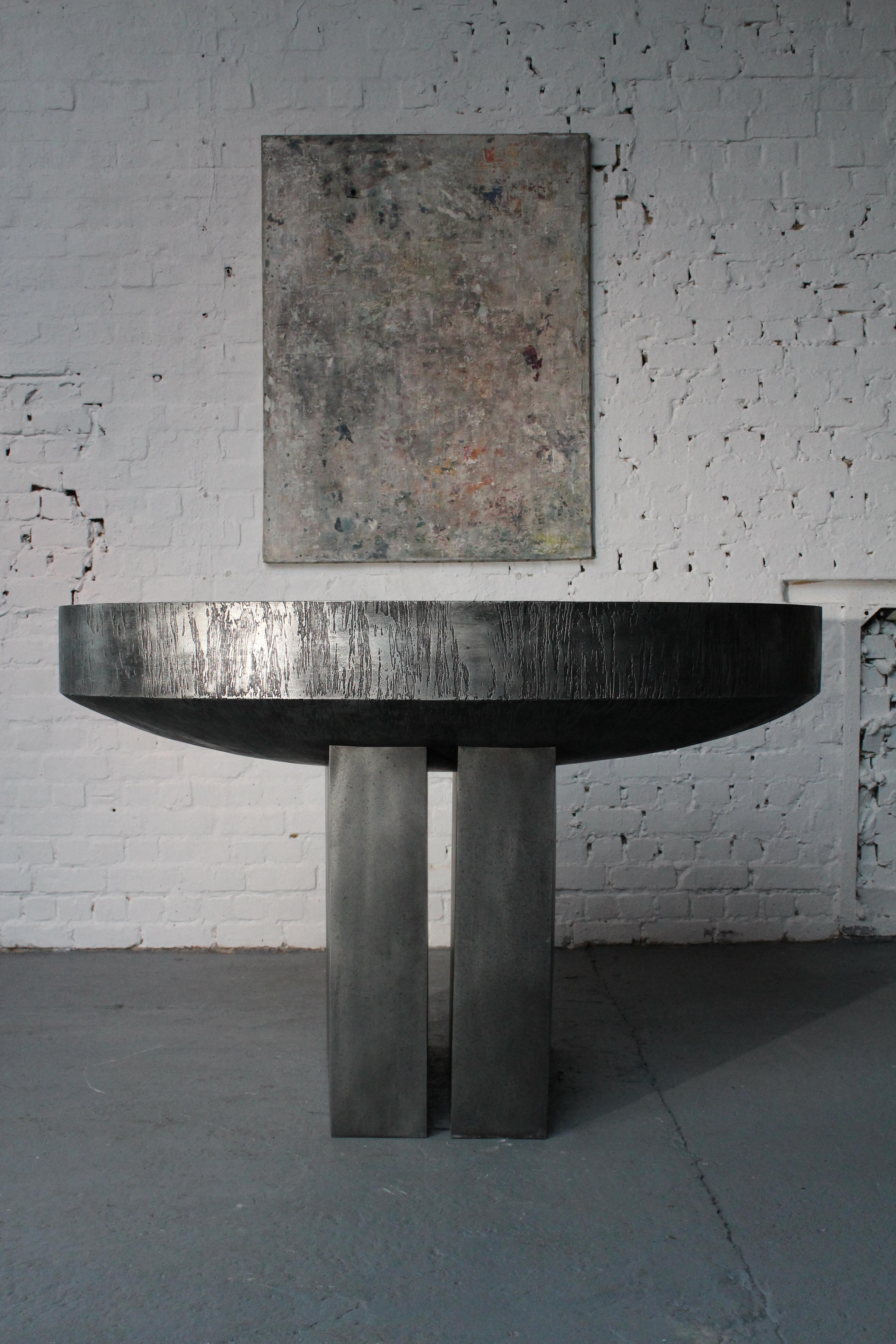 Large console / centre table by the Belgian sculptor Roger Bonduel (1930-2019) in acid-etched and patinated steel. The edge of the table is all around edged and the table top has a beautiful clouded patina. From 1961 to 1966, Roger Bonduel taught