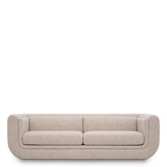 Grand canapé contemporain en tissu beige, avec pieds en bois noir