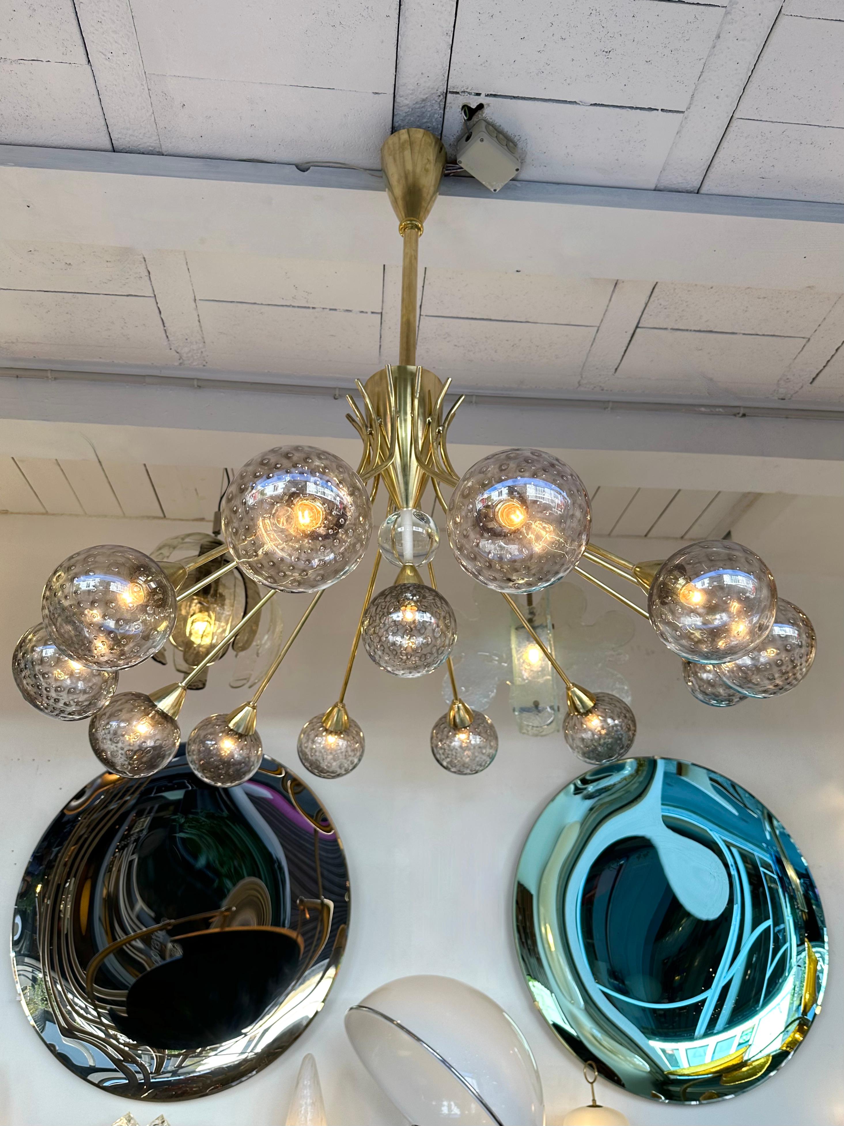 Large brass chandelier ceiling pendant light lamp with grey bubble Murano glass ball globe. Made with old stock of glass from Barovier and Toso from the end of 1960s beginning 1970s. Contemporary work from a small italian artisanal workshop. In the