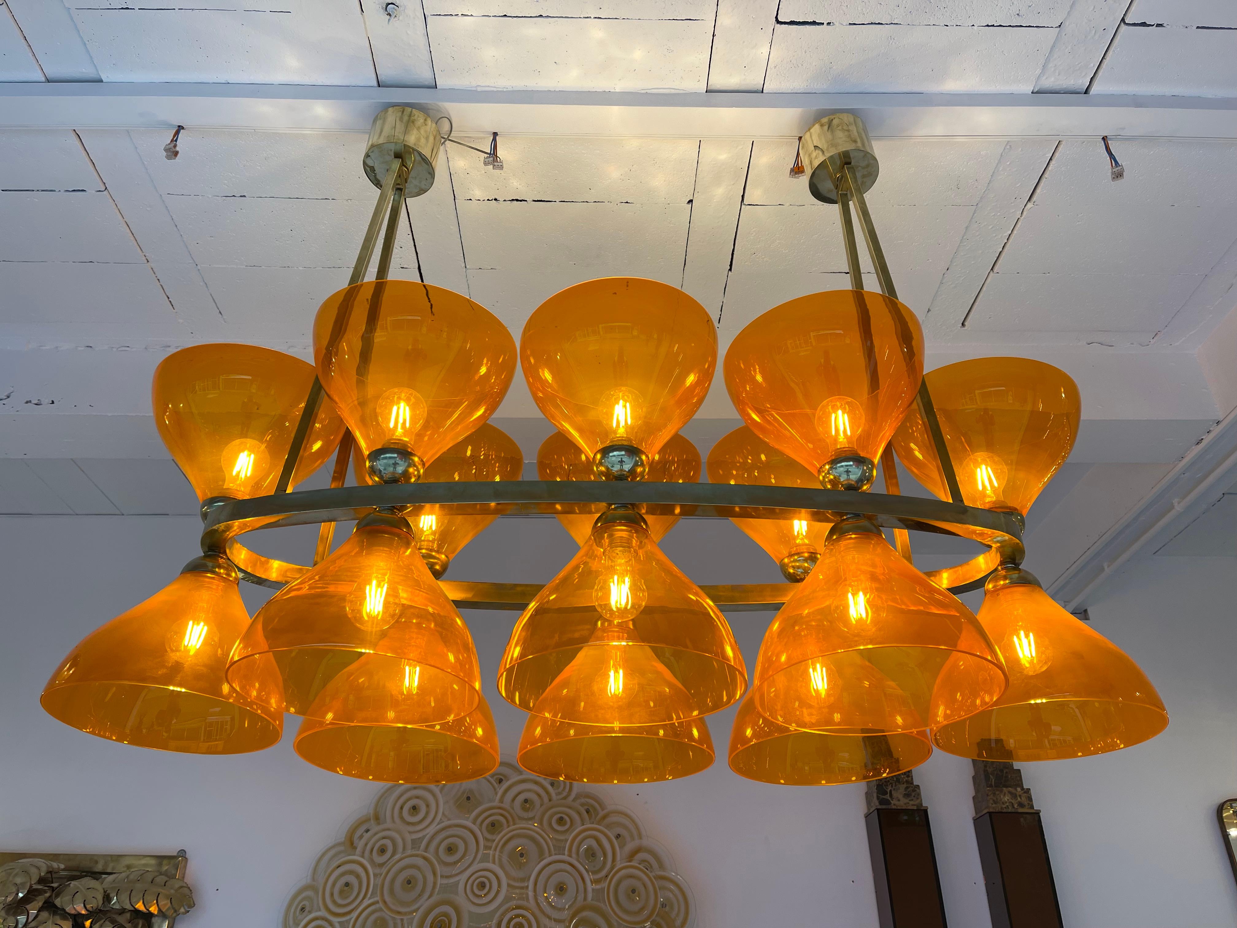 Large brass chandelier ceiling pendant light lamp with large Orange Murano glass cup. Made with old stock of glass from the manufacture Vistosi. High quality glass, original stamp from the manufacture. Contemporary work from a small italian