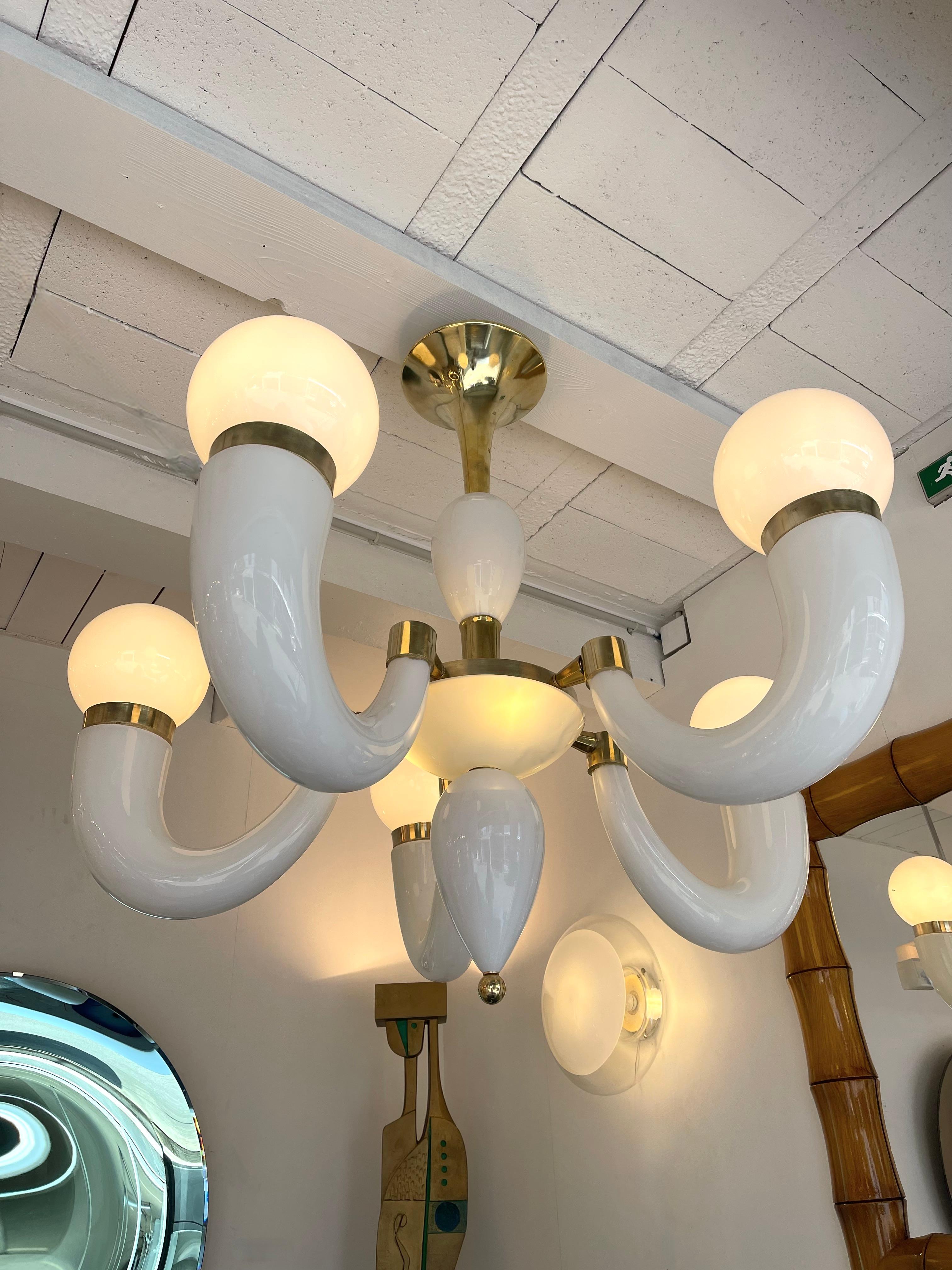 Large brass chandelier ceiling pendant light lamp with white horn, cup and balls Murano glass. Made with old stock of glass from the manufacture Vistosi from the 1970s. Contemporary work from a small italian artisanal workshop. In the mood of