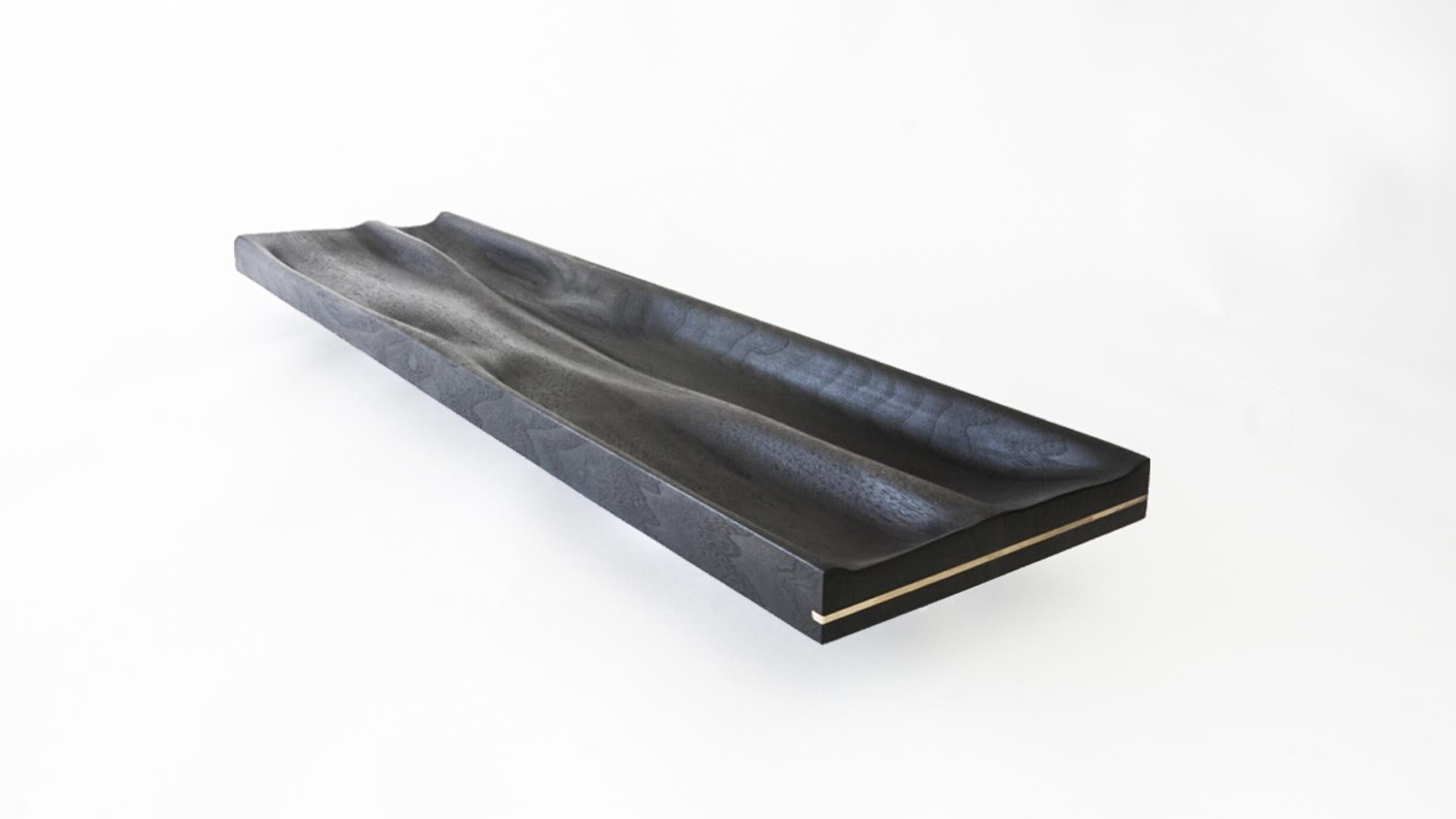 Large contemporary ebonized tray by Vincent Pocsik

Carved walnut tray with ebonized finish.

Natural food safe oil and wax finish.

Vincent Pocsik finds the balance between old and new fabrication techniques working in conjunction to find an
