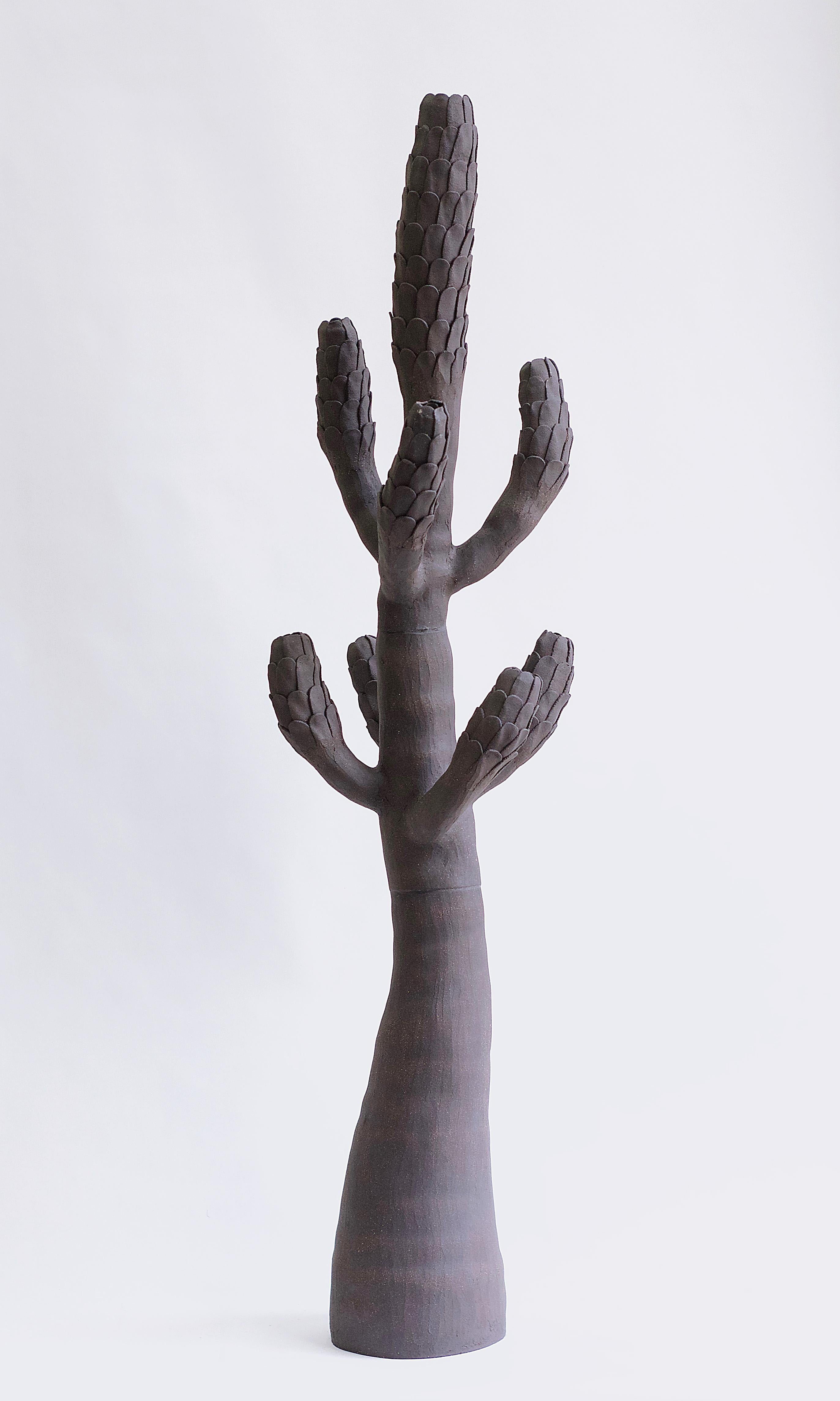 Large ceramic cactus with scaled branches. The organic forms and rich textures express the intense beauty of nature in all its irregularity. This freeform sculpture seems to have sprung up spontaneously like a cactus in an Arizona desert, but