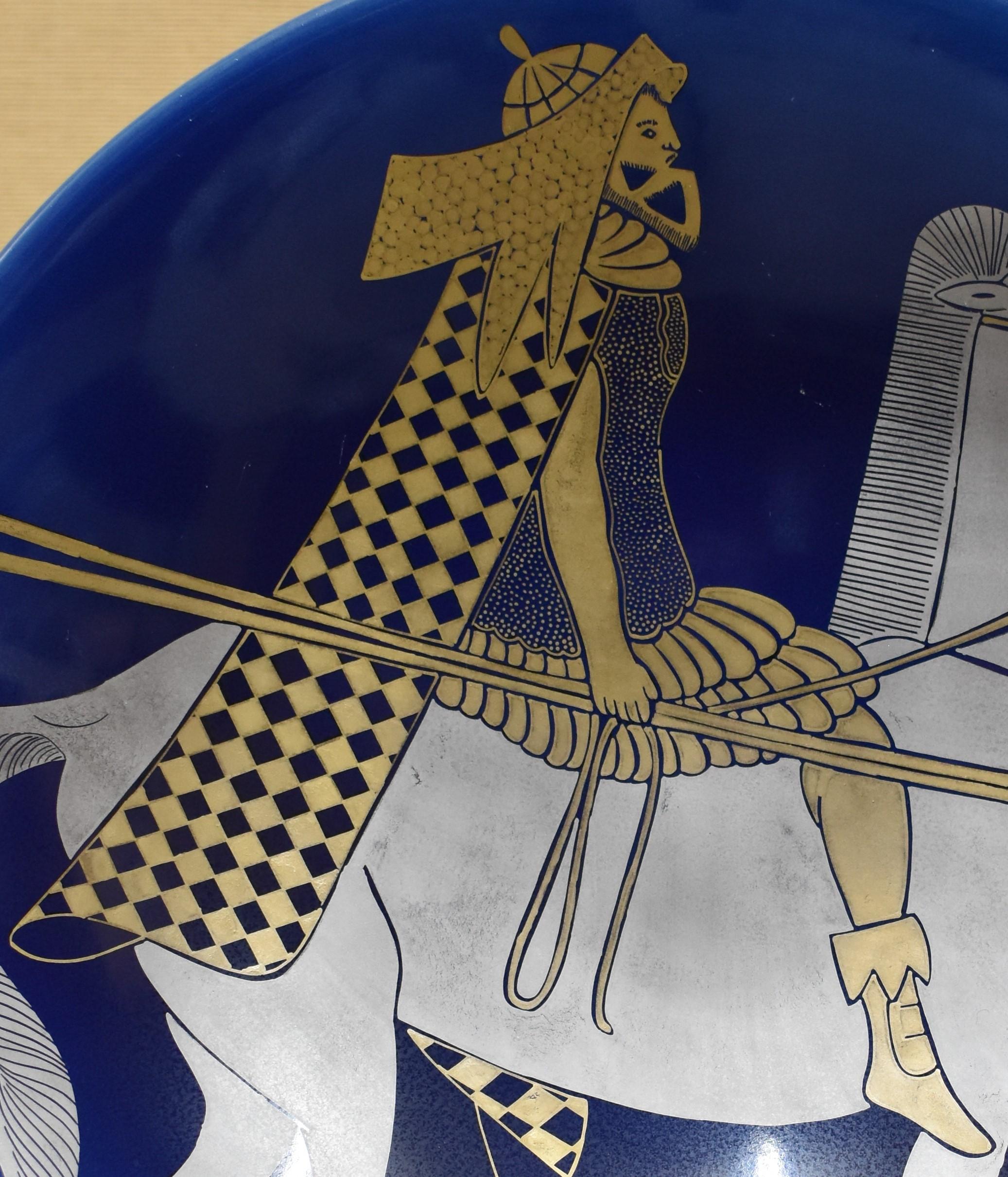 Unique large contemporary Kutani hand-painted porcelain charger, a masterpiece showcasing the artist’s vision of an ancient Persian warrior riding a horse, depicted in platinum and gold against a beautiful deep blue.

The creator of this work is a