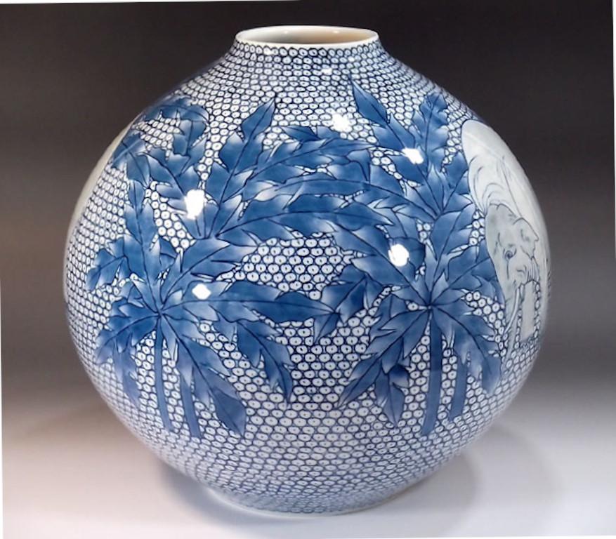 Unique contemporary Japanese porcelain decorative vase, intricately hand painted in underglazed blue on an elegantly shaped globular porcelain body, a signed piece by widely respected Japanese master porcelain artist in the Imari-Arita tradition and