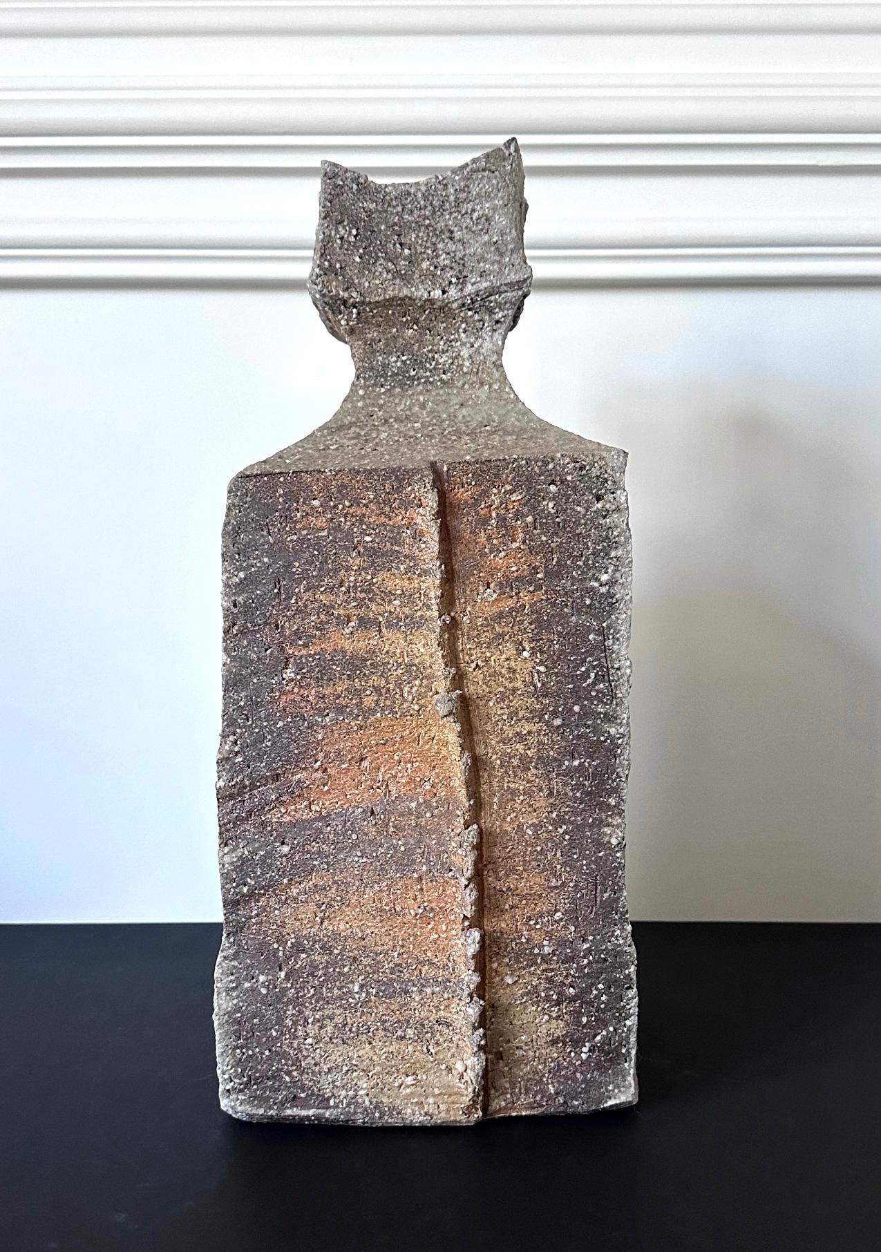 A striking stoneware vase made in the tradition of Shigaraki ware by celebrated Japanese potter Kohyama Yasuhisa (1936-) in the year of 2005. Born in the town of Shigaraki, Yasuhisa was one of the first potters who revived the ancient techniques by