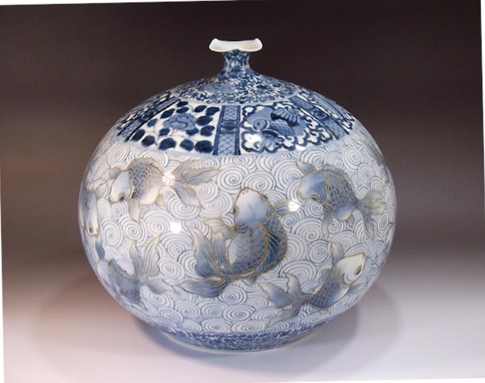Large porcelain decorative vase, hand painted in beautiful shades of blue on an elegantly shaped ovoid porcelain body, a signed piece by widely acclaimed Japanese master porcelain artist in the Imari-Arita tradition. In 2016, the British Museum