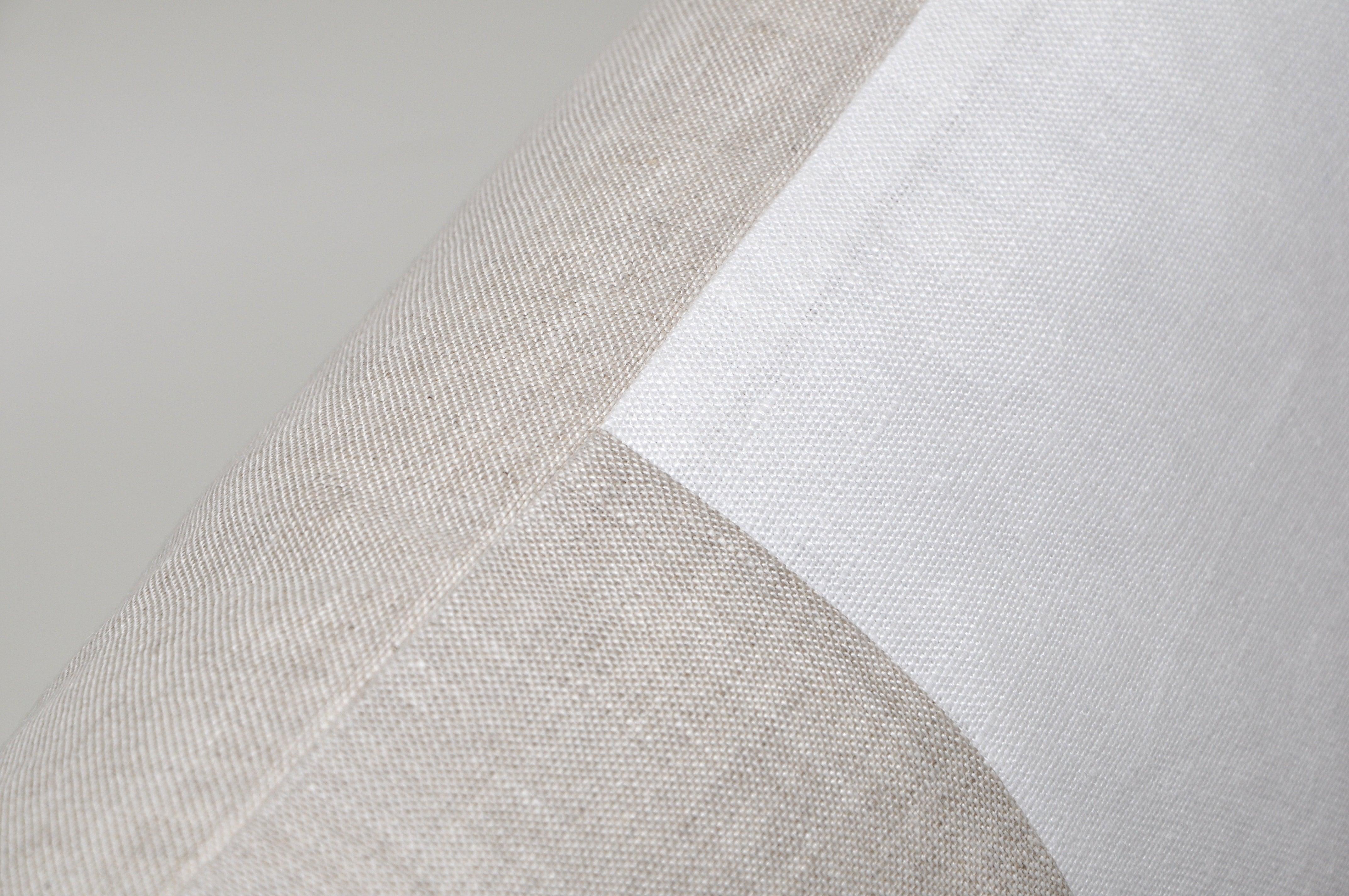 A custom made luxury contemporary pillow (cushion) of 100 % pure Irish linen. A signature combination of Classic pristine white matched with traditional oatmeal. The oatmeal is a beautiful mottled color which is the mixture of a white warp and the