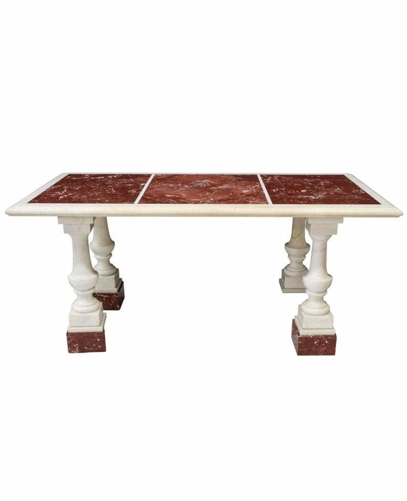 A stunning and most impressive Continental European, most likely Italian, rouge and Carrera marble column table. Born in the 19th century, finished in Grand Tour Neo-classical taste, having a long rectangular top inset with three rouge red with