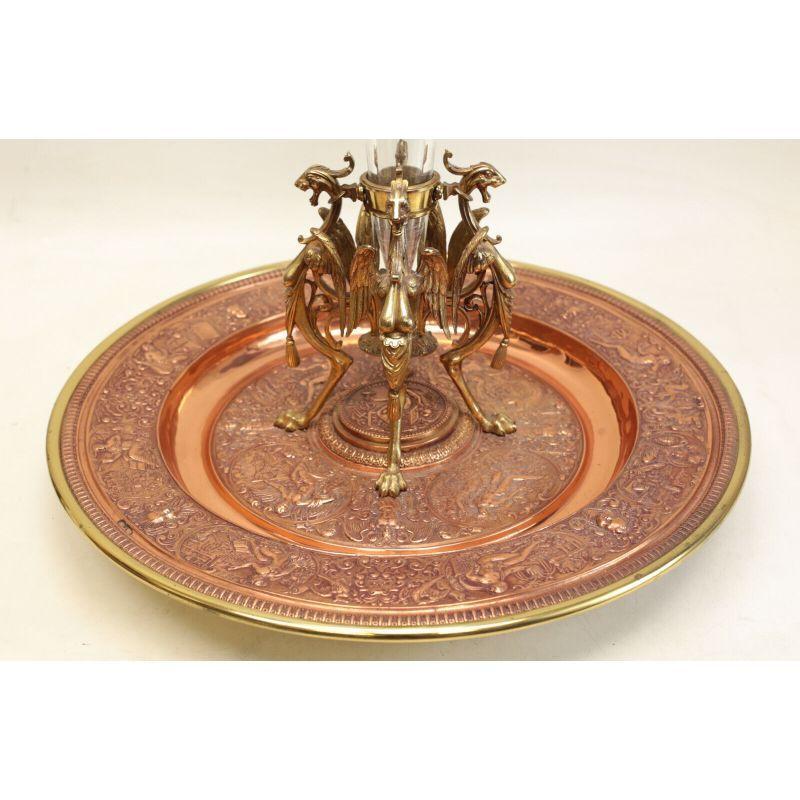 Large Continental neoclassical gilt bronze & cut glass centerpiece tray, c1920

Large Continental neoclassical gilt bronze & cut glass centerpiece tray, circa 1920. Ornately hand chased Neoclassical figures throughout the tray. Figural griffons to