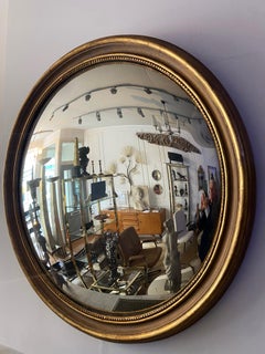 Grande specchio convesso in legno dorato