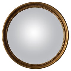 Grand miroir convexe en bois doré