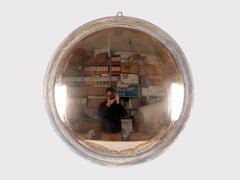 Large convex mirror with a blue wooden frame. Italy 1870.
