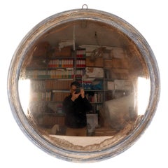 Large convex mirror with a blue wooden frame. Italy 1870.