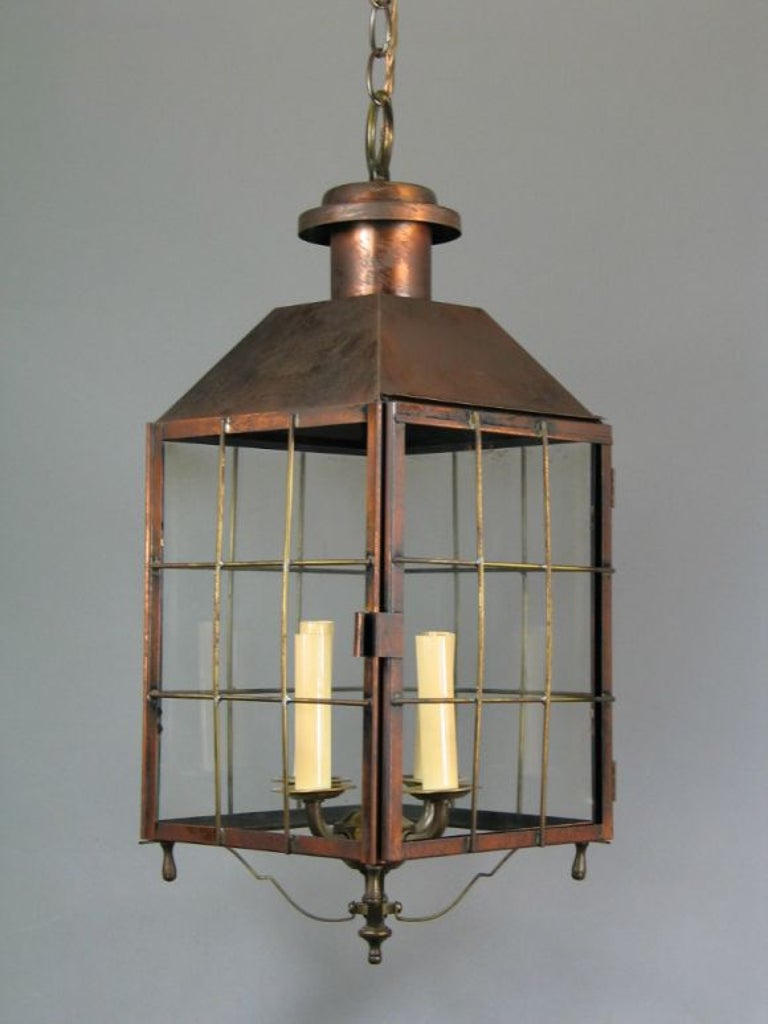 Handmade copper lantern with four-light cluster and glass panels.