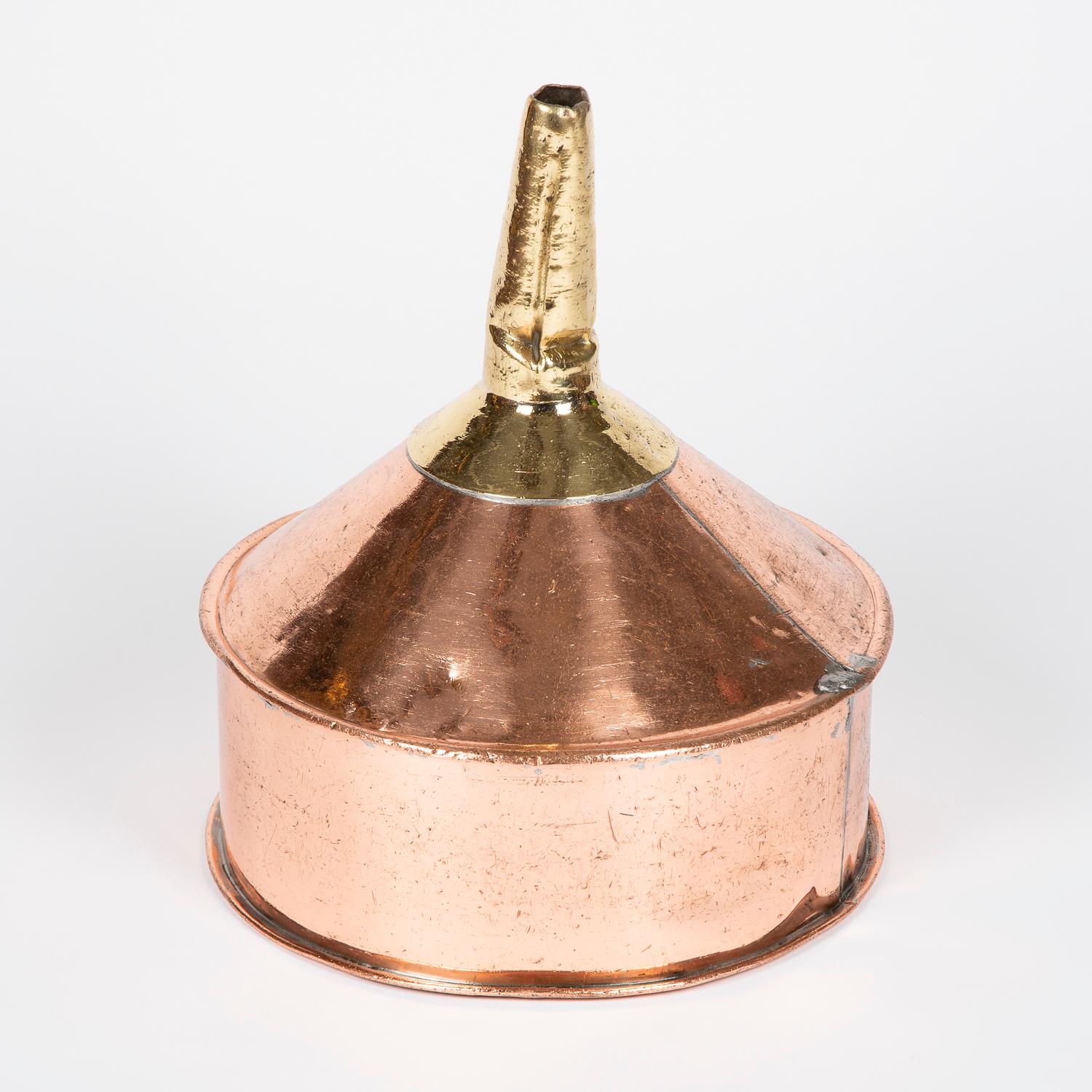 A large late 19th century copper and brass funnel.

From Wiltshire County, England.