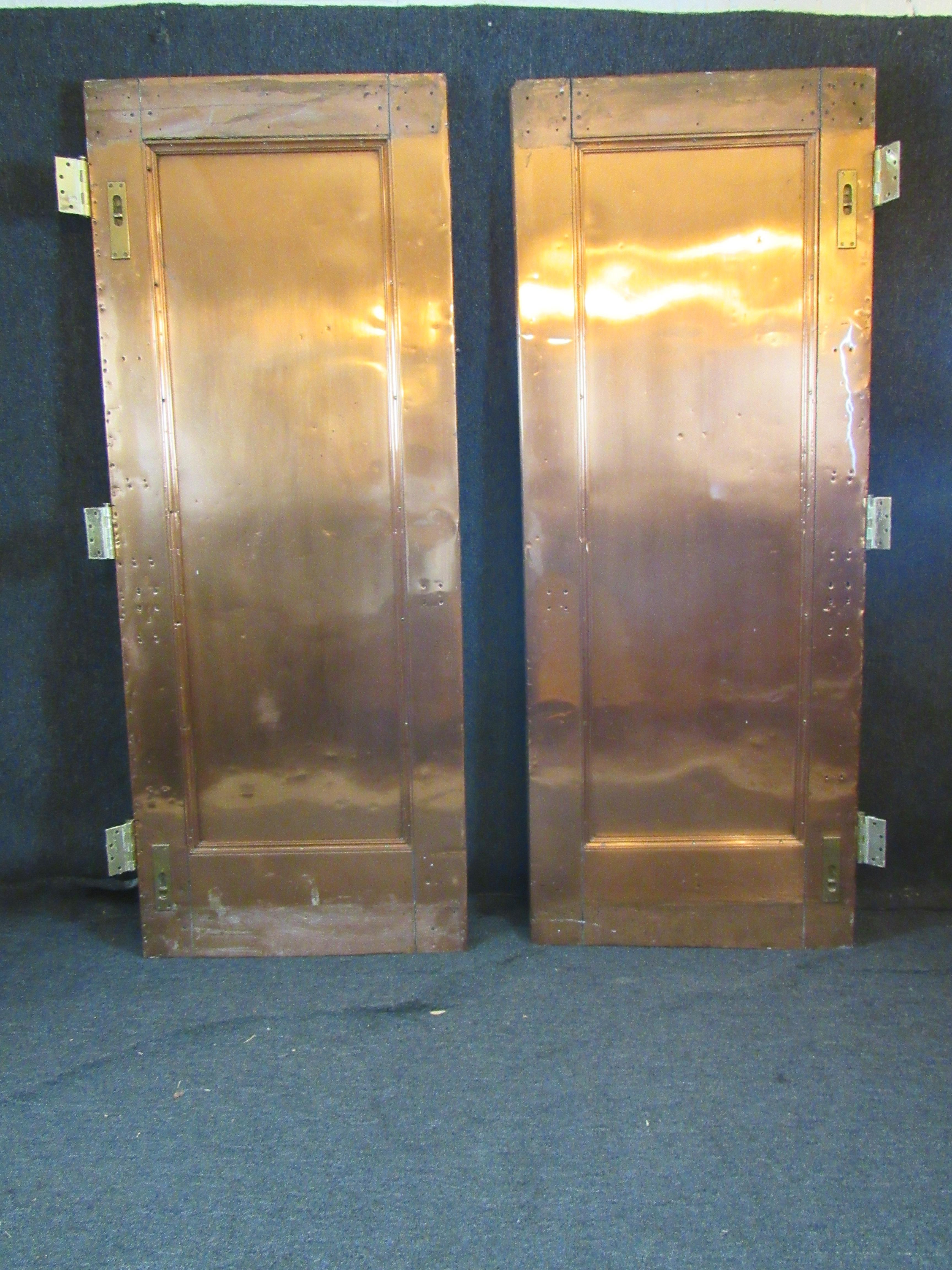 Make your home the talk of the town with these truly one-of-a-kind vintage custom copper plated doors! Standing nearly 80