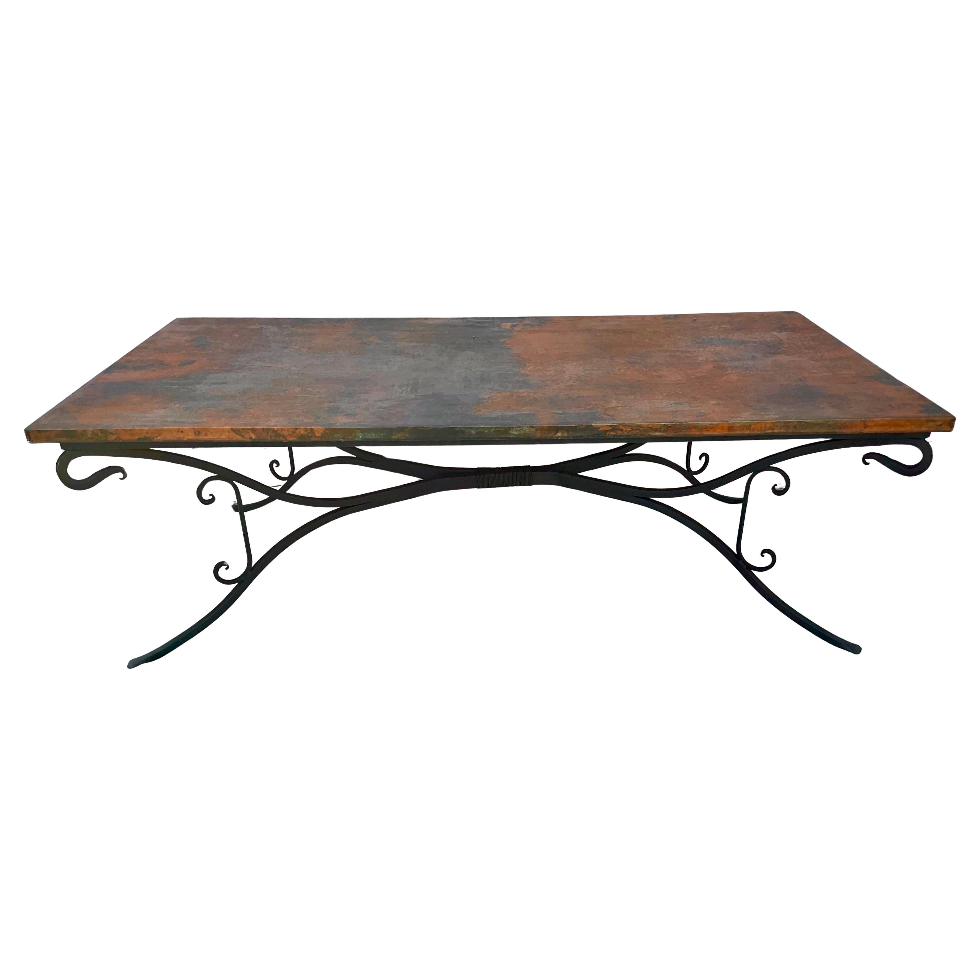  Stunning Large Copper Top Dining Table on Hand Forged Iron Base.
Hand Hammered Copper Top Dining Table. Rectangular table is large and features a hammered copper clad top surface and rests on a large beautifully scrolled hand forged black iron