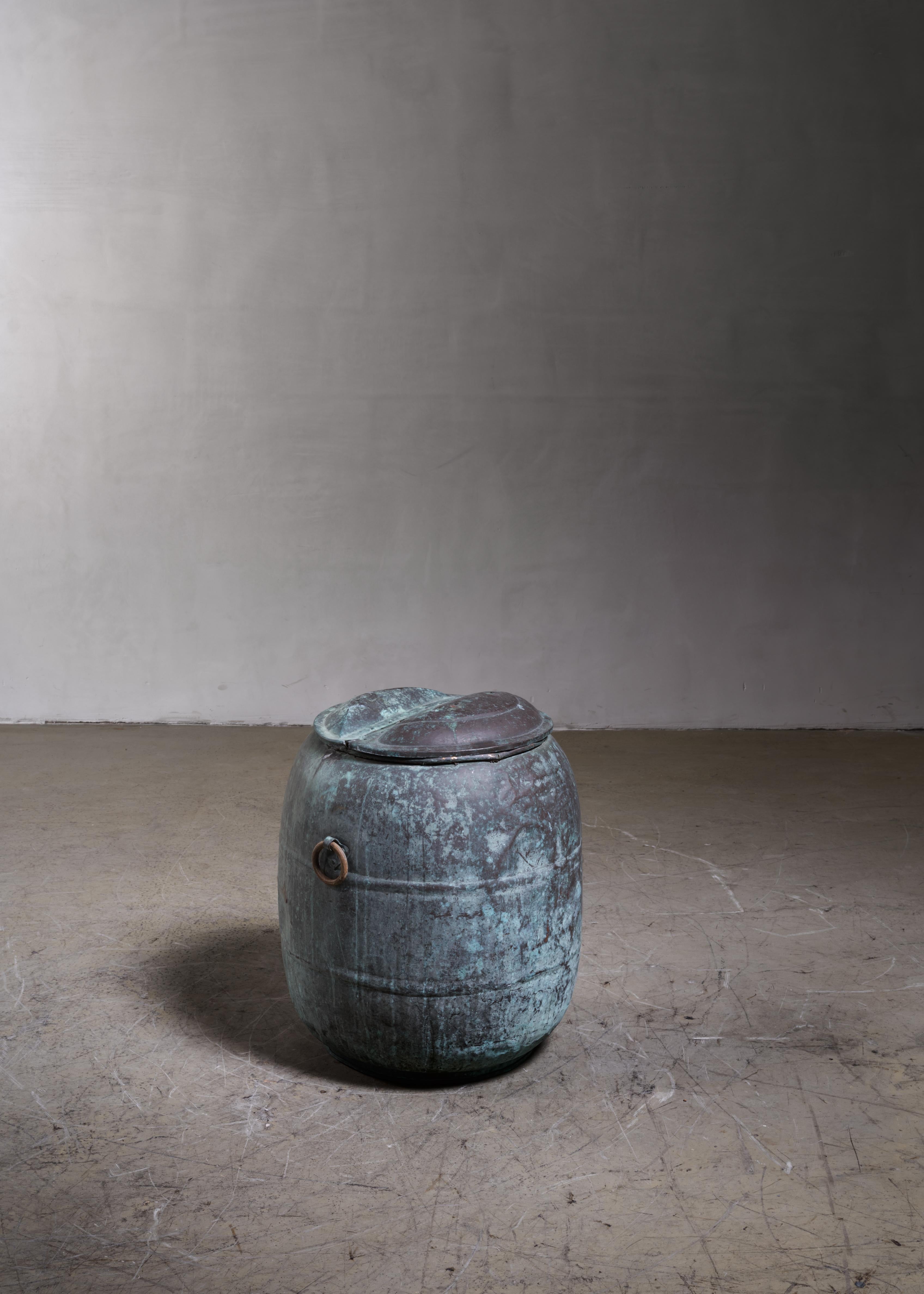 A large patinated copper water barrel with wonderful patina.