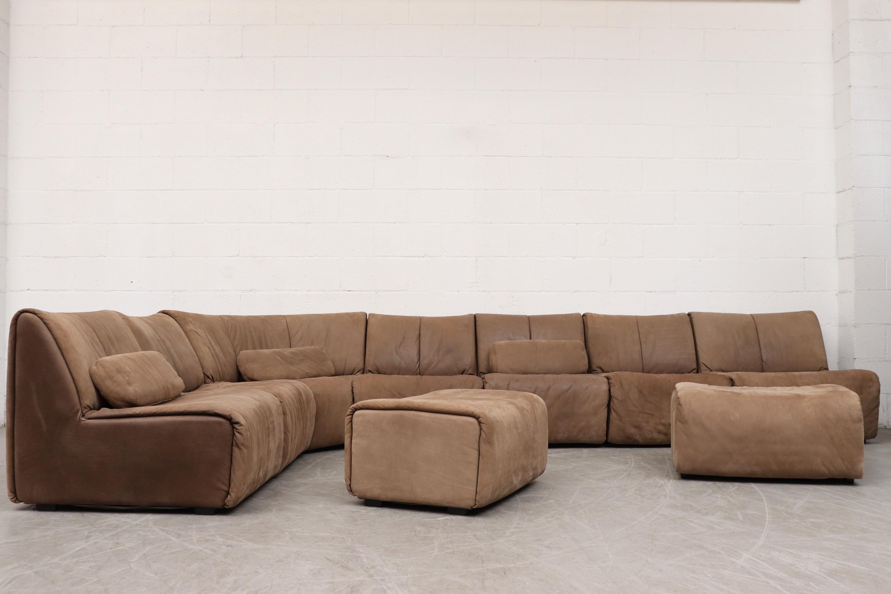 Large COR leather modular sectional sofa with 2 ottomans. 7 sofa pieces, and 3 pillows. In original condition with some visible wear, consistent with age and use. Color may vary slightly from photo.