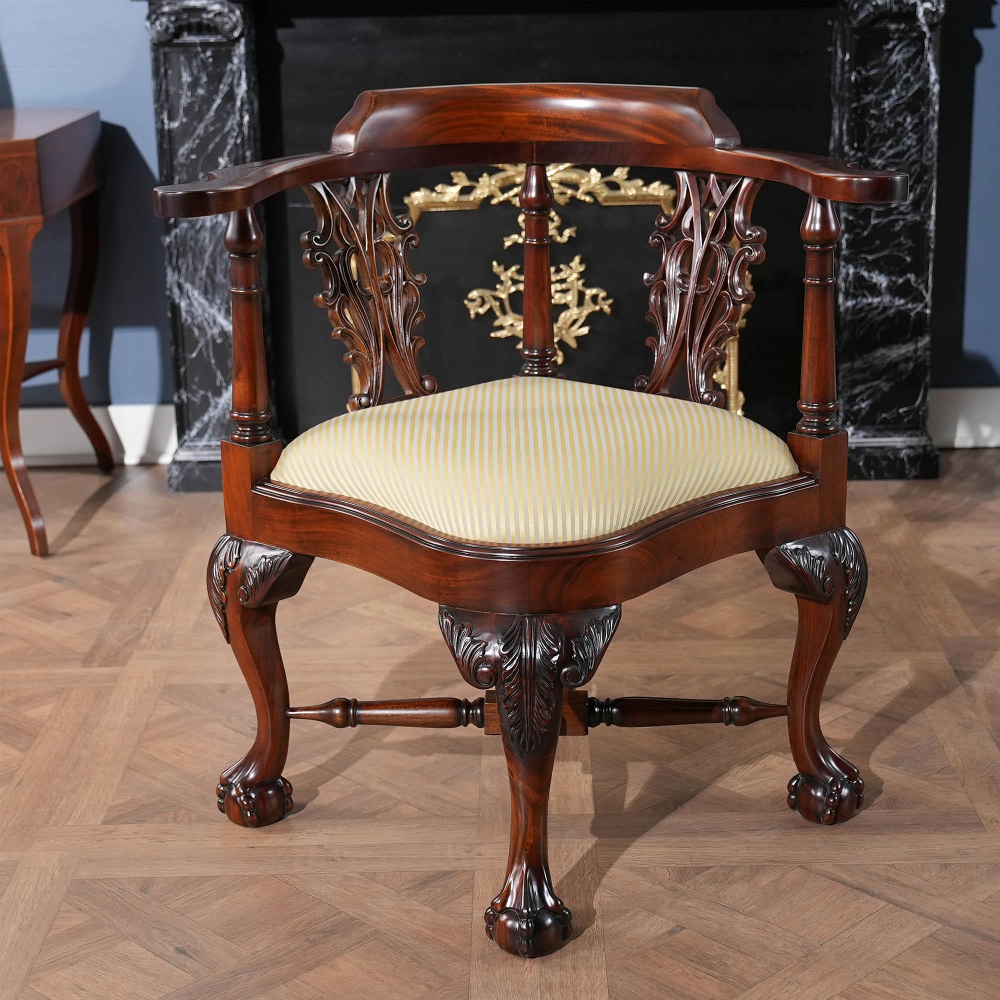 A high quality, hand carved, solid mahogany Large Corner Chair. Our Large Corner Chair features hand carved acanthus leaves on the knees and scrollwork in the back splat all executed by hand using traditional methods in solid mahogany. Standing on