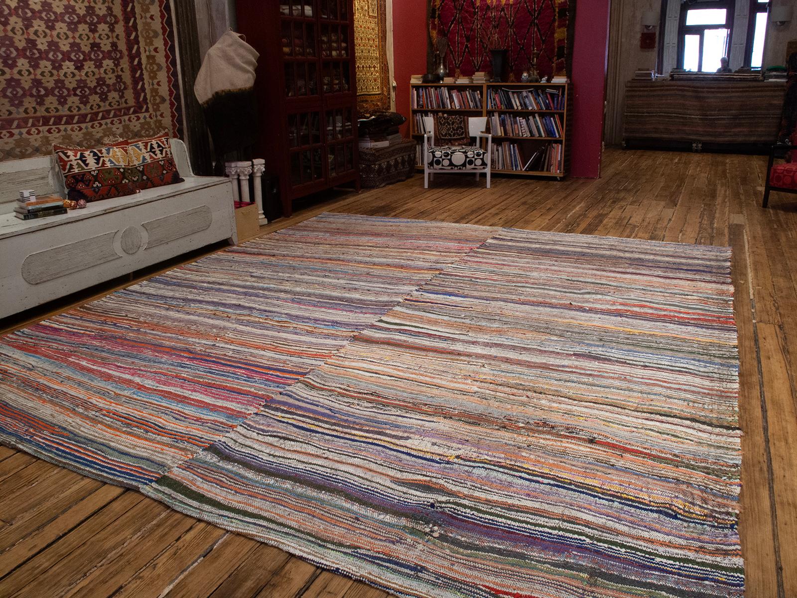 A large floor cover from Western Turkey, flat-woven with colorful cotton rag, made in two panels on a narrow village loom. Rare large size. 