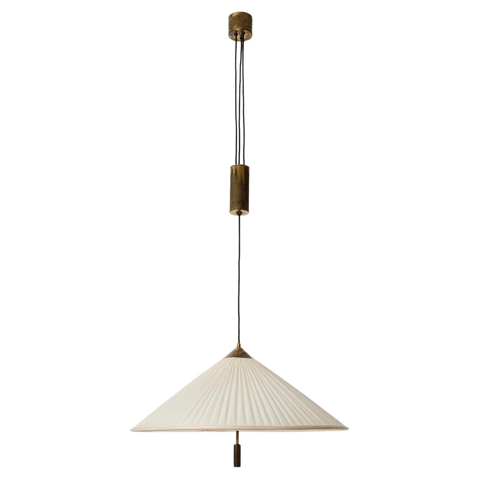 A large and fantastic height adjustable brass counter balance pendant lamp manufactured in 1930s.
The light is based on a design by Josef Frank. In the mid-1920s, Josef Frank and Oskar Wlach founded the furnishing company 
