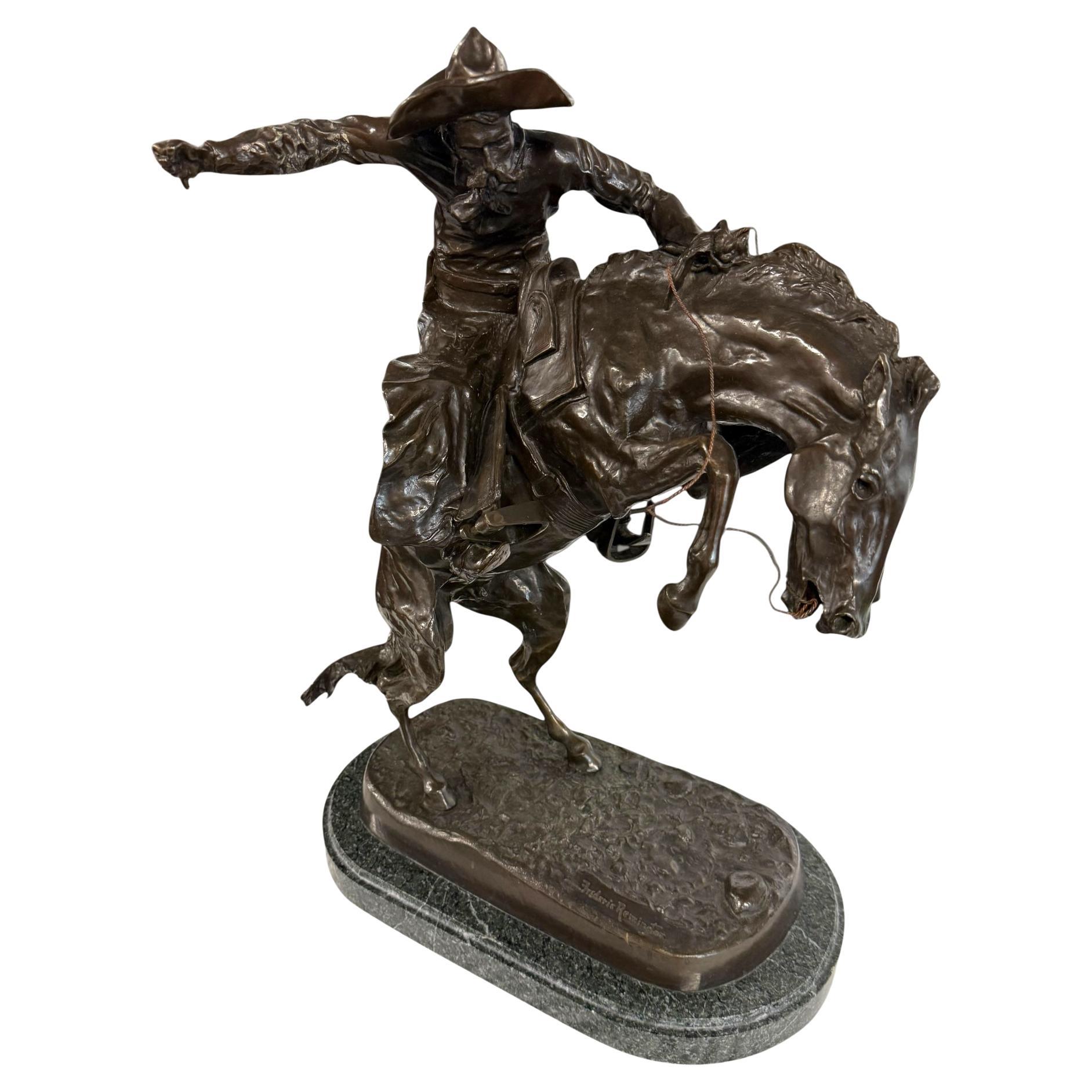 Grande cowboy in bronzo 'Bronco Buster' (after) Frederic Remington, inizio-metà del XX secolo