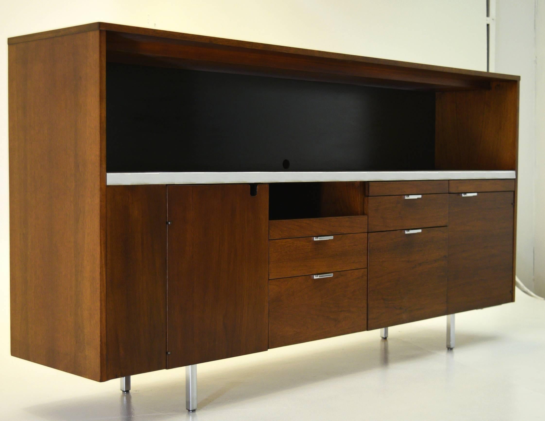 George Nelson
Herman Miller, Executive Office Group (EOG) Series
circa 1962
Lacquered walnut, steel and chrome.
Measures: 80.75 wide x 18.5 deep x 43 inch tall

Customized for a client, this large credenza boasts storage more akin to a desk and