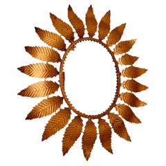 Grande specchio "Sunburst" a forma di corona in metallo dorato e vetro, intorno al 1950