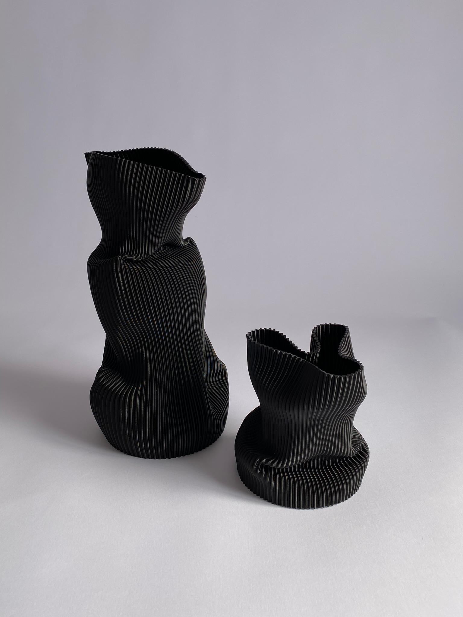 3D-printed in bioplastic and hand-shaped, the Crumpled Vase combines digital precision with expressive craftsmanship. Its sculptural form and delicate texture make each piece a one-of-a-kind creation, individually molded by the artist’s hands.

Made