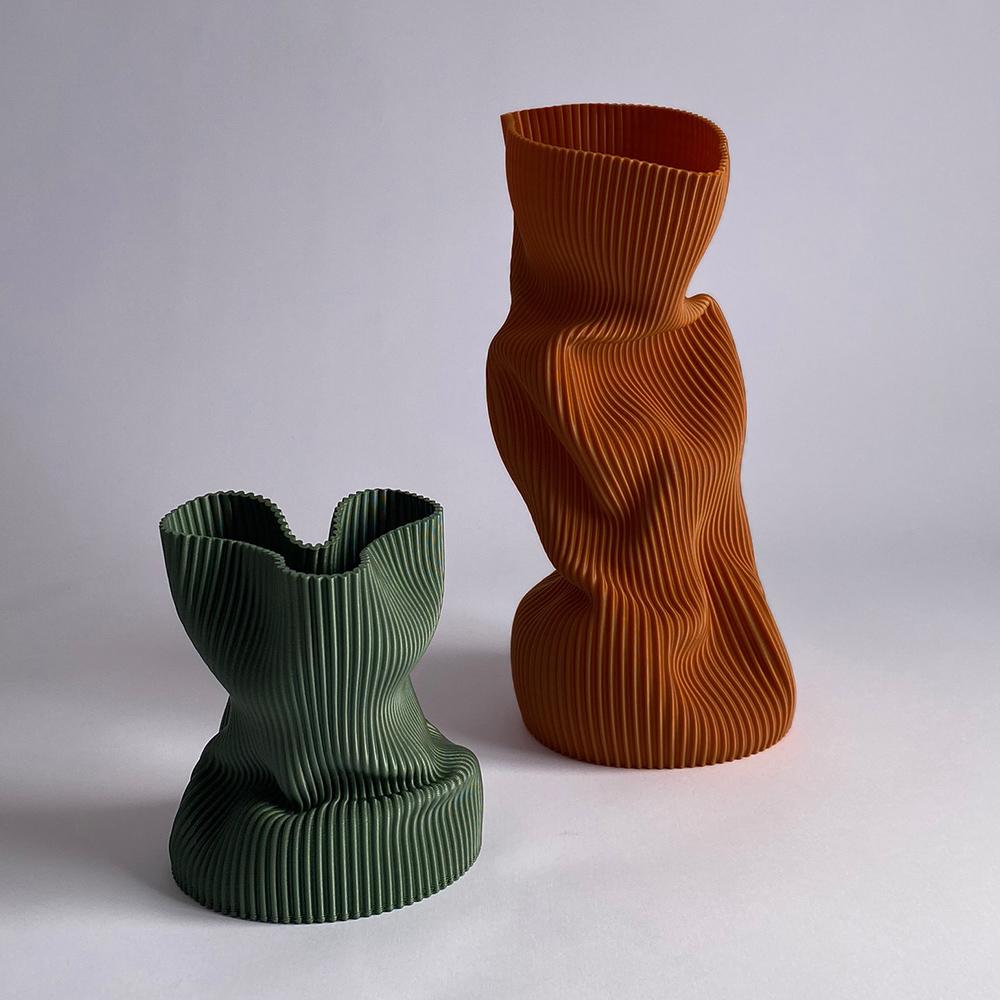 3D-printed in bioplastic and hand-shaped, the Crumpled Vase combines digital precision with expressive craftsmanship. Its sculptural form and delicate texture make each piece a one-of-a-kind creation, individually molded by the artist’s hands.

Made