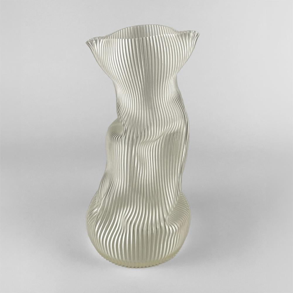 3D-printed in bioplastic and hand-shaped, the Crumpled Vase combines digital precision with expressive craftsmanship. Its sculptural form and delicate texture make each piece a one-of-a-kind creation, individually molded by the artist’s hands.

Made