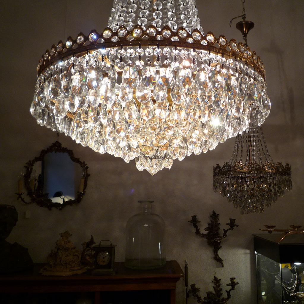 Large crystal chandelier.

Richly decorated chandelier made of Bohemian, handcut crystal for illuminating larger rooms. The chandelier was produced in the sixties of the last century, but clearly uses neoclassical forms.

Due to the design with