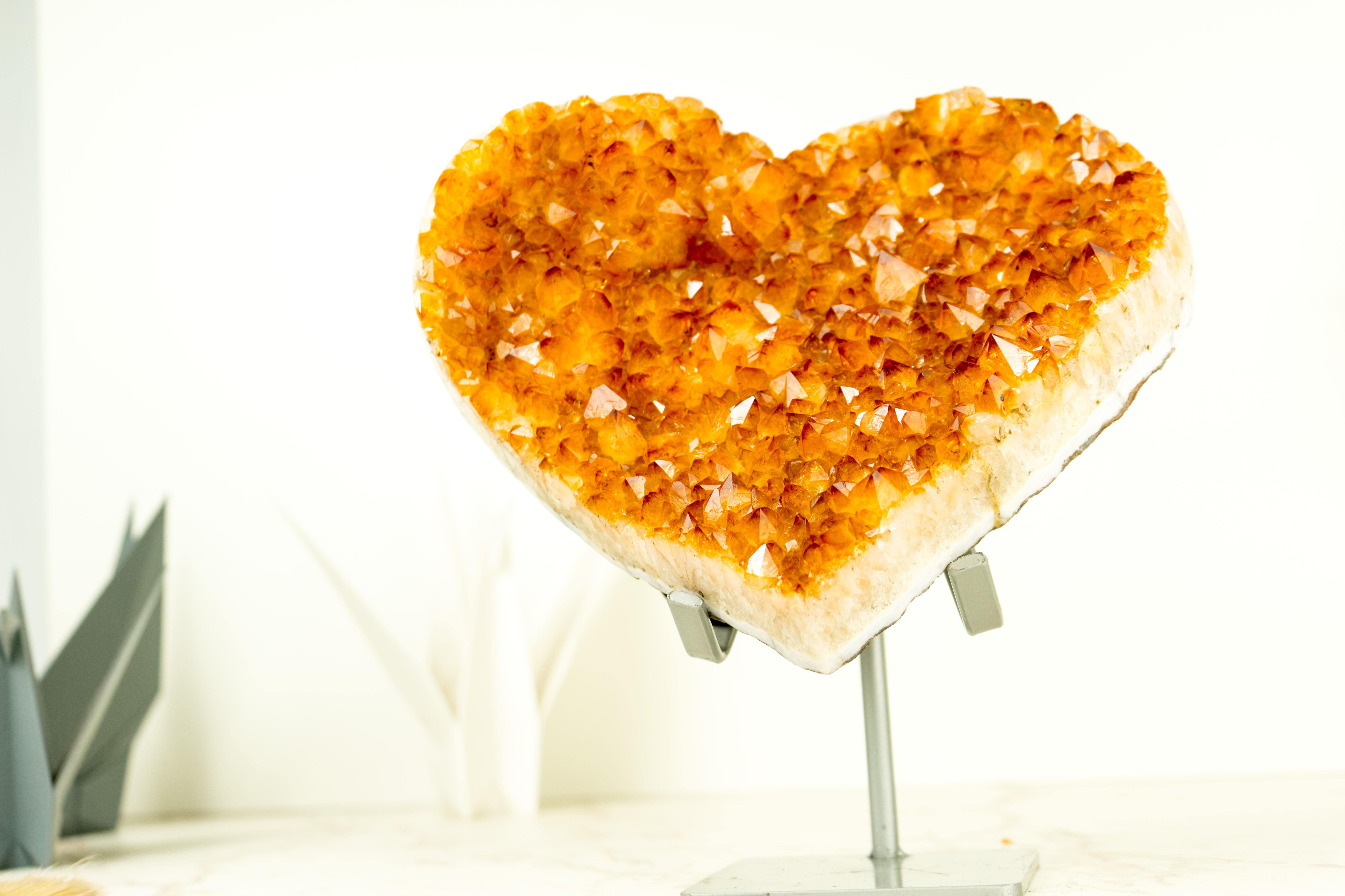 A beautiful, large, and unique Citrine Heart, this specimen results from natural geological art and skilled craftsmanship to create this Heart-shaped artwork. Its 